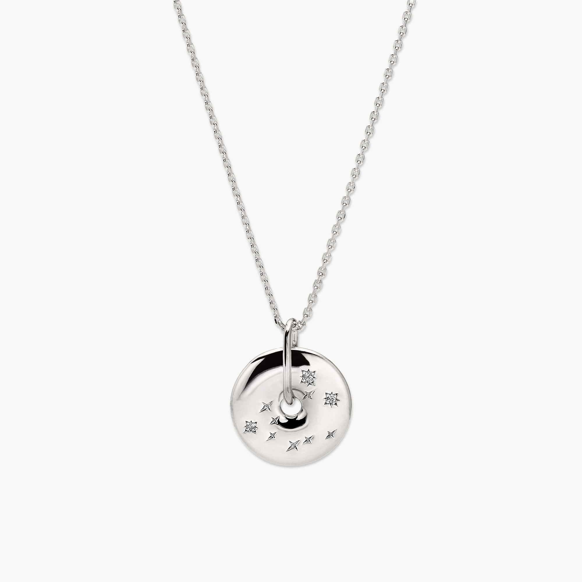 Zodiac Pendant Necklace: A silver necklace featuring an 18k gold vermeil spinning disc, adorned with white sapphire gemstones arranged in a constellation pattern.