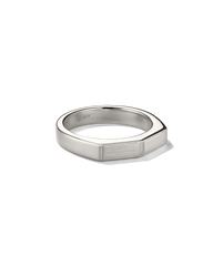 Slim Faceted Ring: A modern sterling-silver band with a minimalist geometric top, featuring a 925 stamp inside, displayed against a black background.