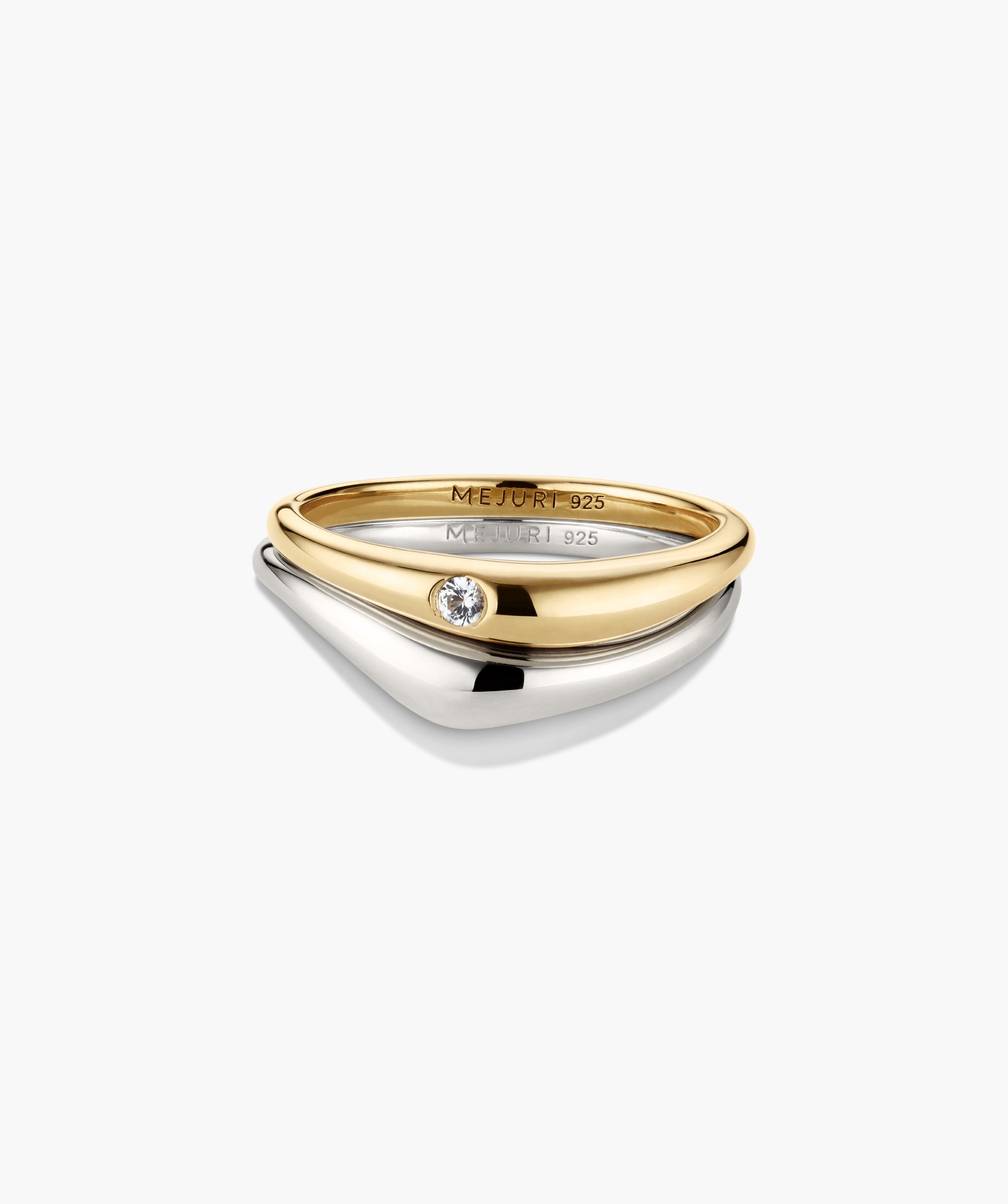 Organic DÃ´me Nesting Ring Set featuring a yellow-gold plated ring with a bezel-set diamond and a smooth sterling-silver band, designed to nest together.