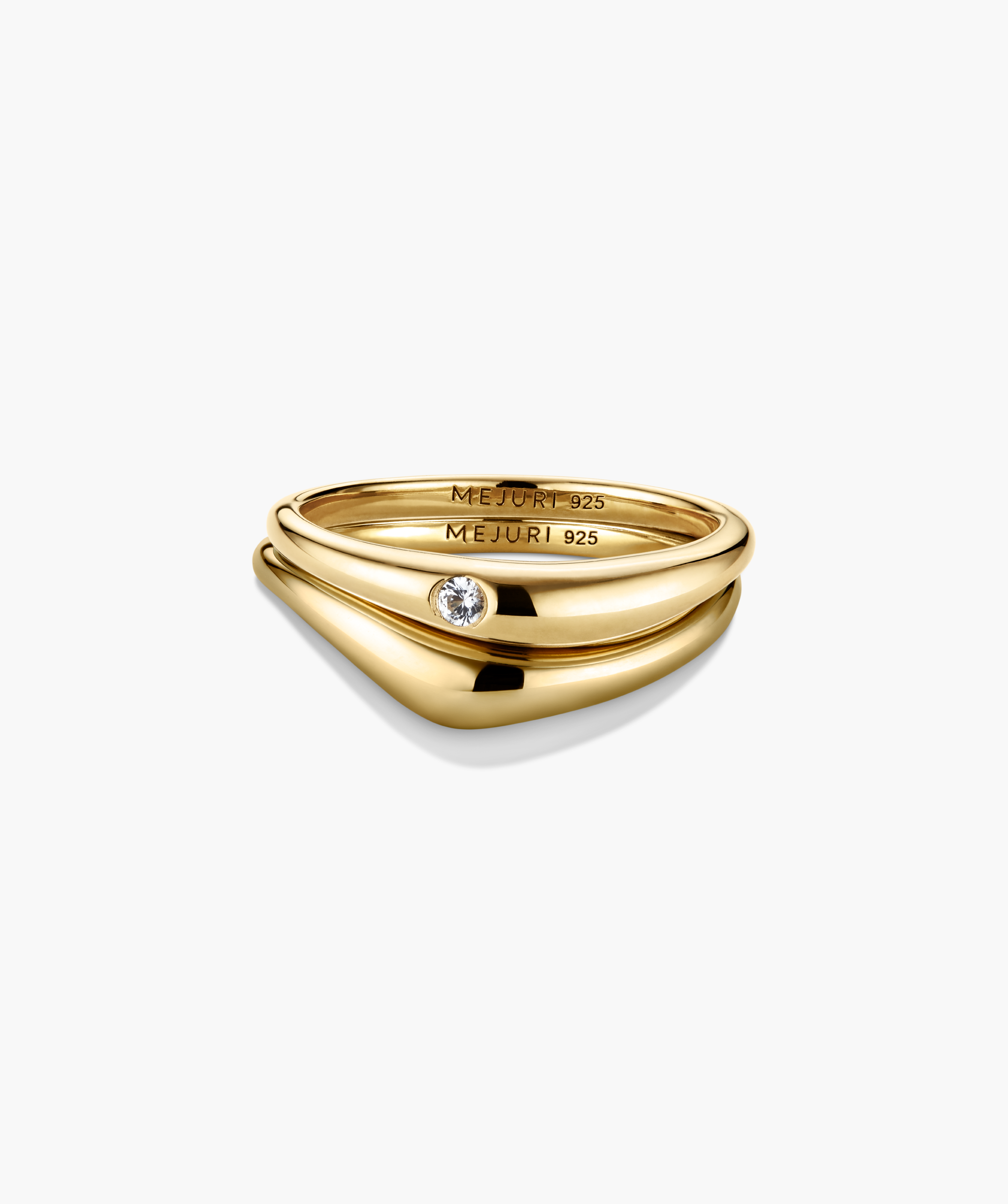 Organic DÃ´me Nesting Ring Set, featuring polished gold stacking rings with sterling-silver core, includes one band with a bezel-set round white gemstone.
