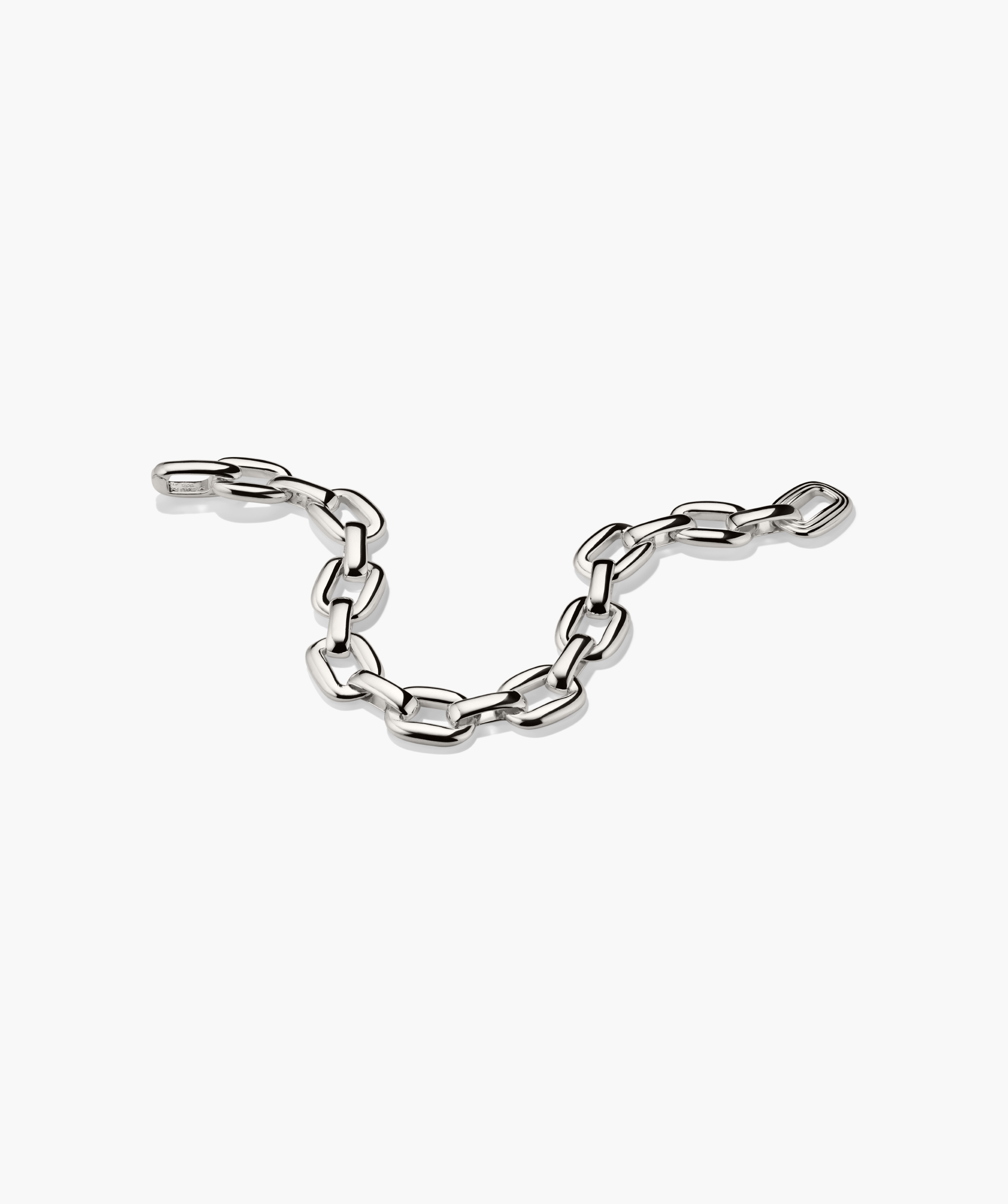 Stevie Bracelet: polished silver oval-link chain with a textured link, designed for playful elegance and everyday wear.