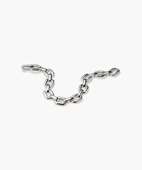 Stevie Bracelet: polished silver oval-link chain with a textured link, designed for playful elegance and everyday wear.