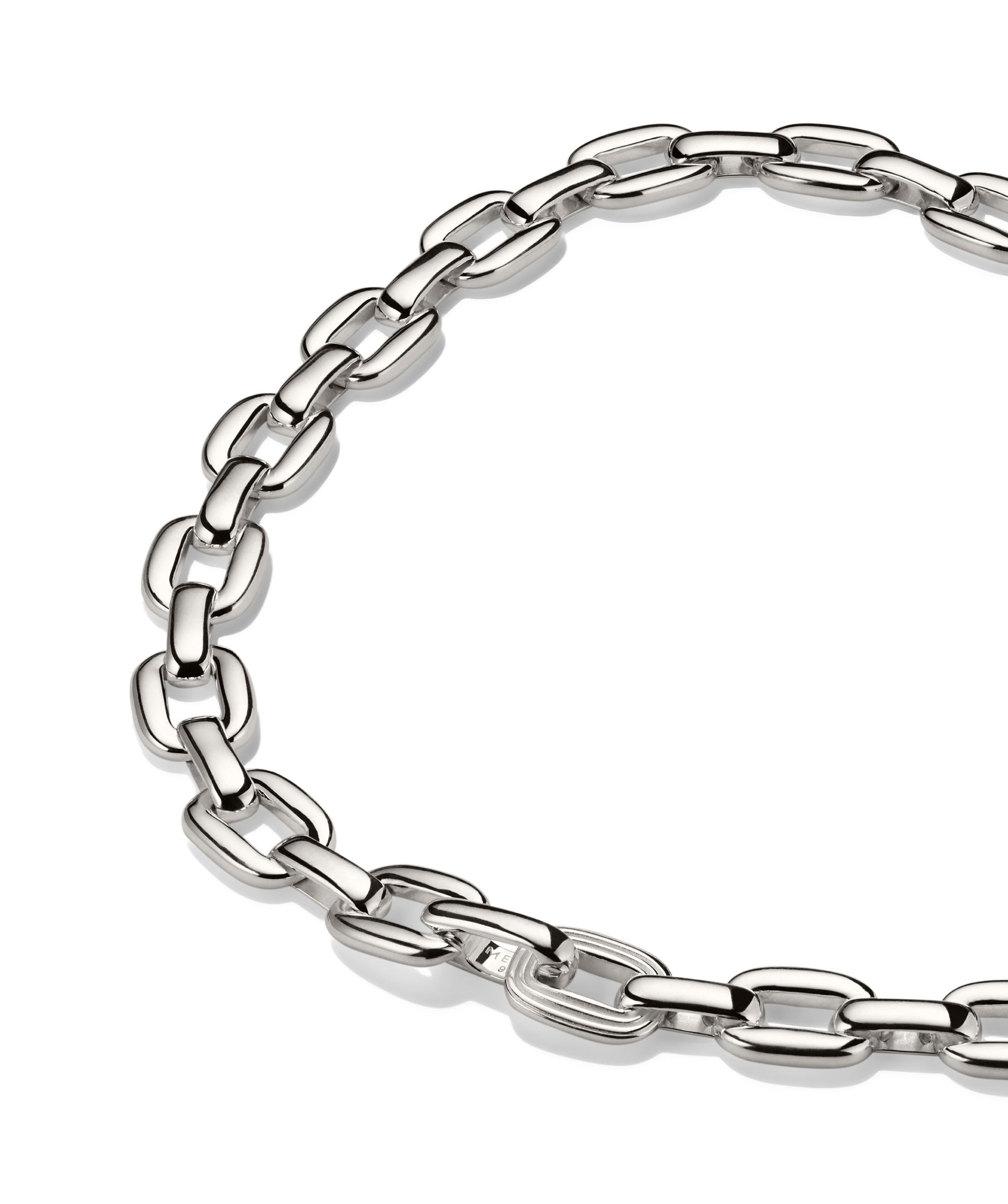 Silver Stevie Chain necklace with oblong, rounded links, featuring a single textured link for added detail, laid against a black background.