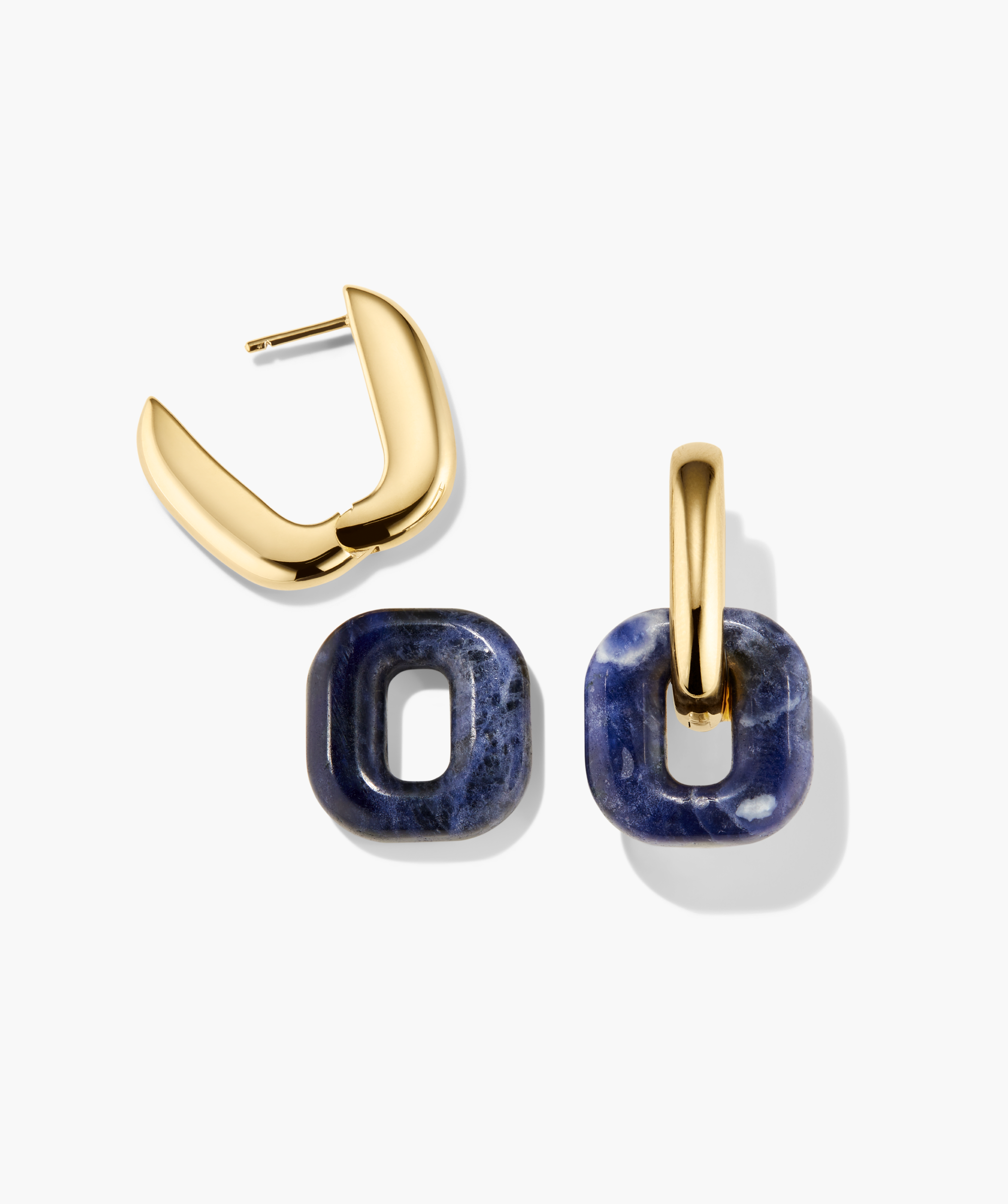 Stevie Hoops earrings with a chunky gold-tone hoop and interchangeable navy stone pendants, showcasing versatility and style in customizable drop earrings.