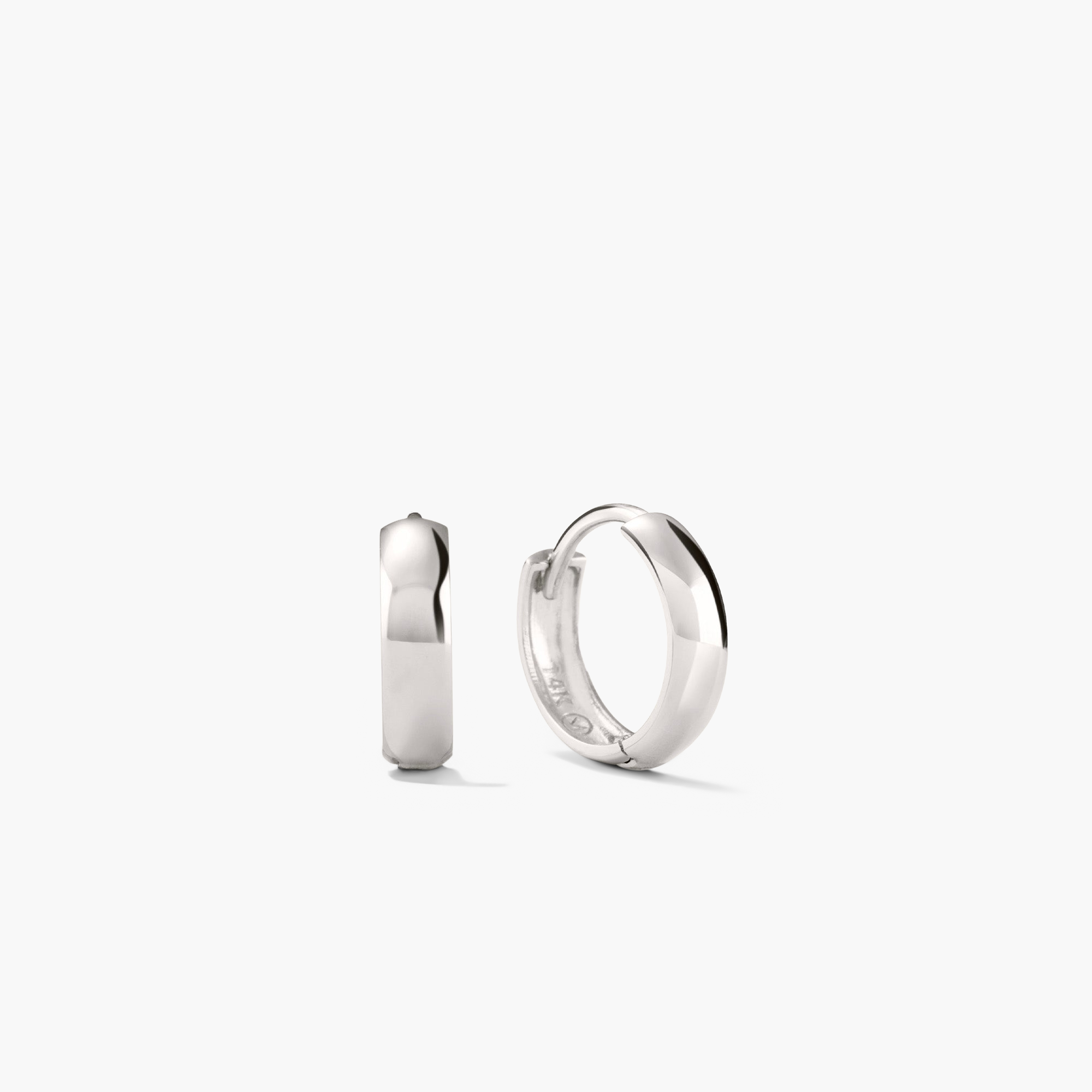 Silver Bold Huggie Hoops, formerly known as Bold Hoops, showcasing a sleek, stylish design perfect for elevating any outfit and boosting your mood.