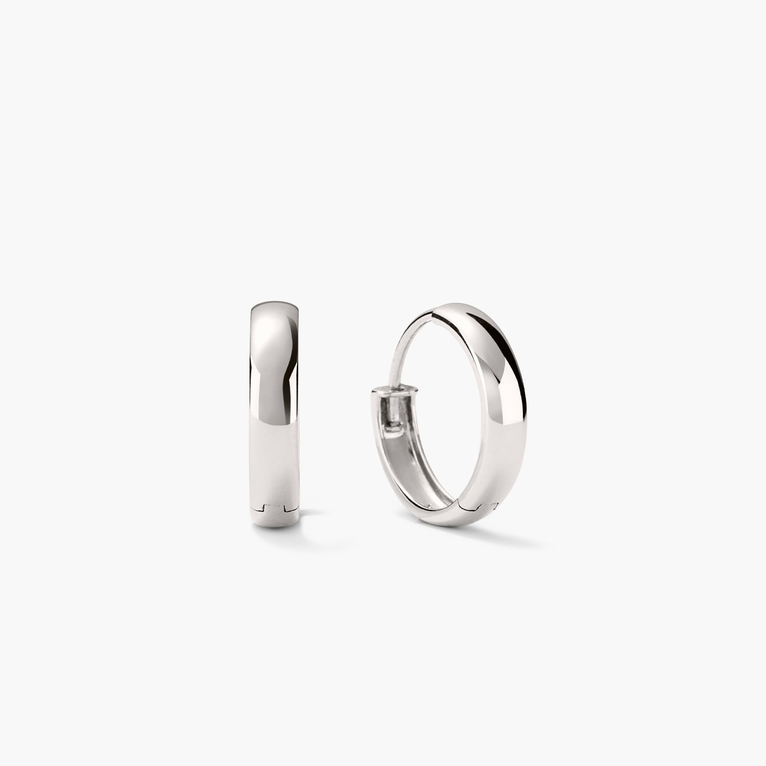 Bold Small Hoops: a pair of silver hoop earrings, designed to elevate any outfit with their sleek, fashionable look.