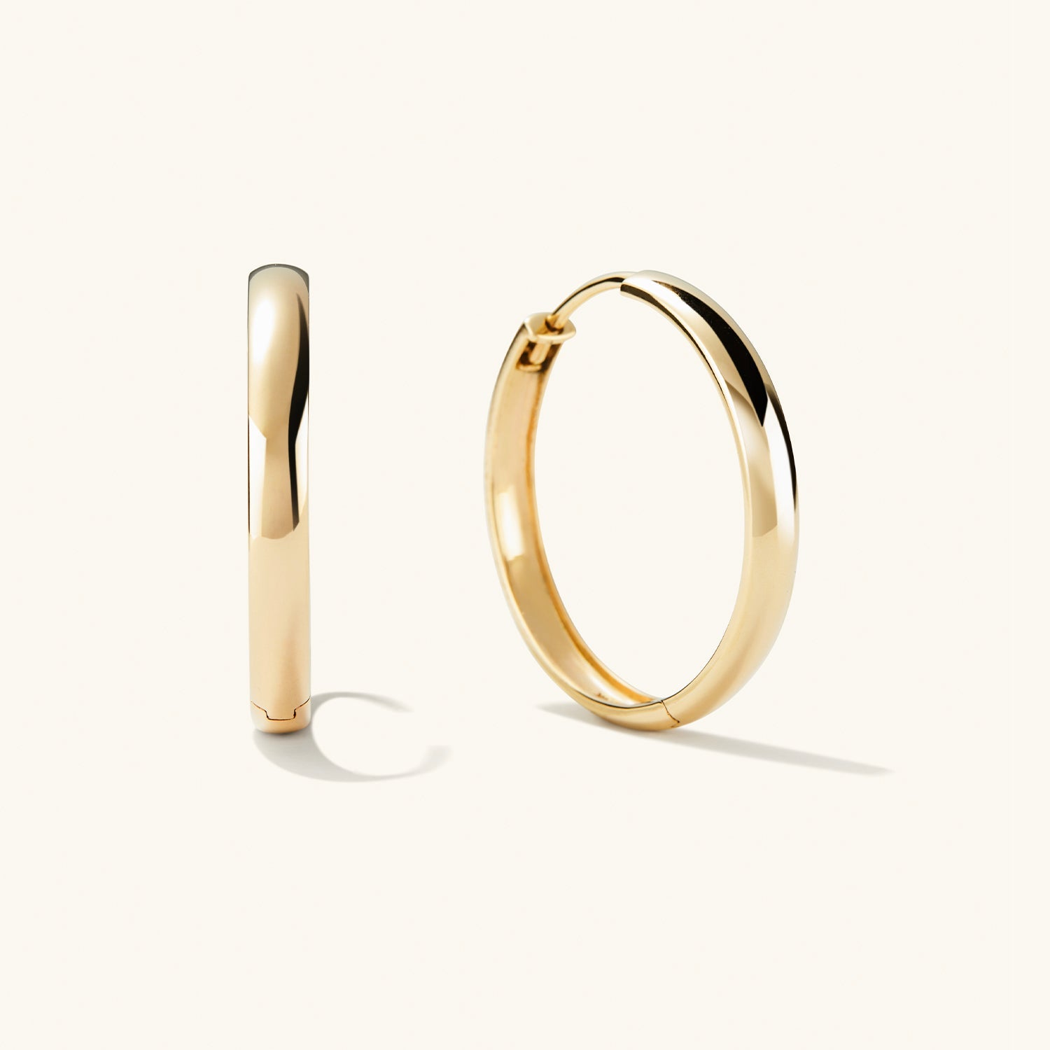Bold Large Hoops: A pair of handcrafted, recycled 14k solid gold hoop earrings, designed to elevate any outfit.