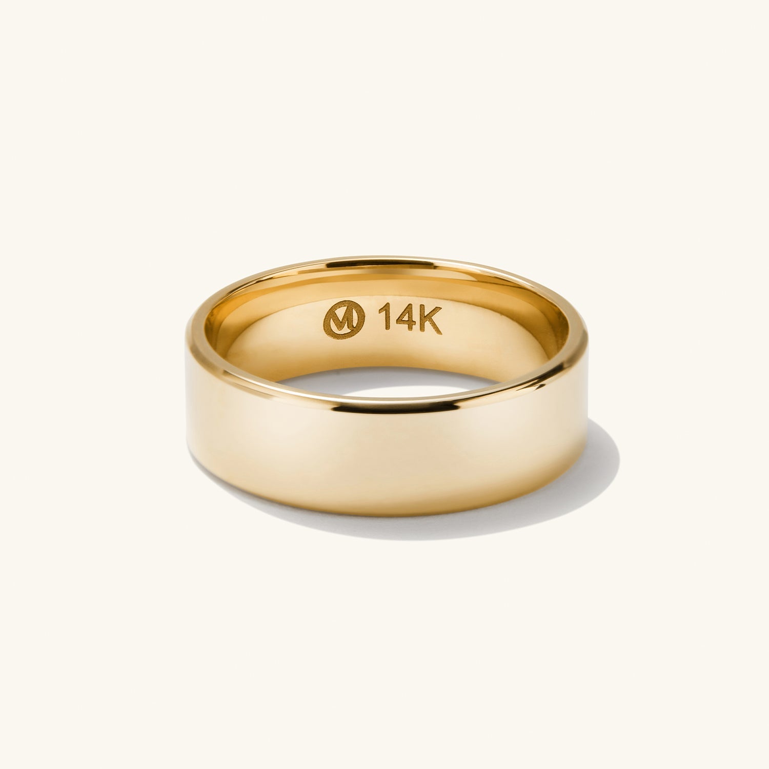 6mm Smooth Band: A gold ring featuring a sleek, smooth design, ideal for engagements or daily wear, highlighted in close-up detail.