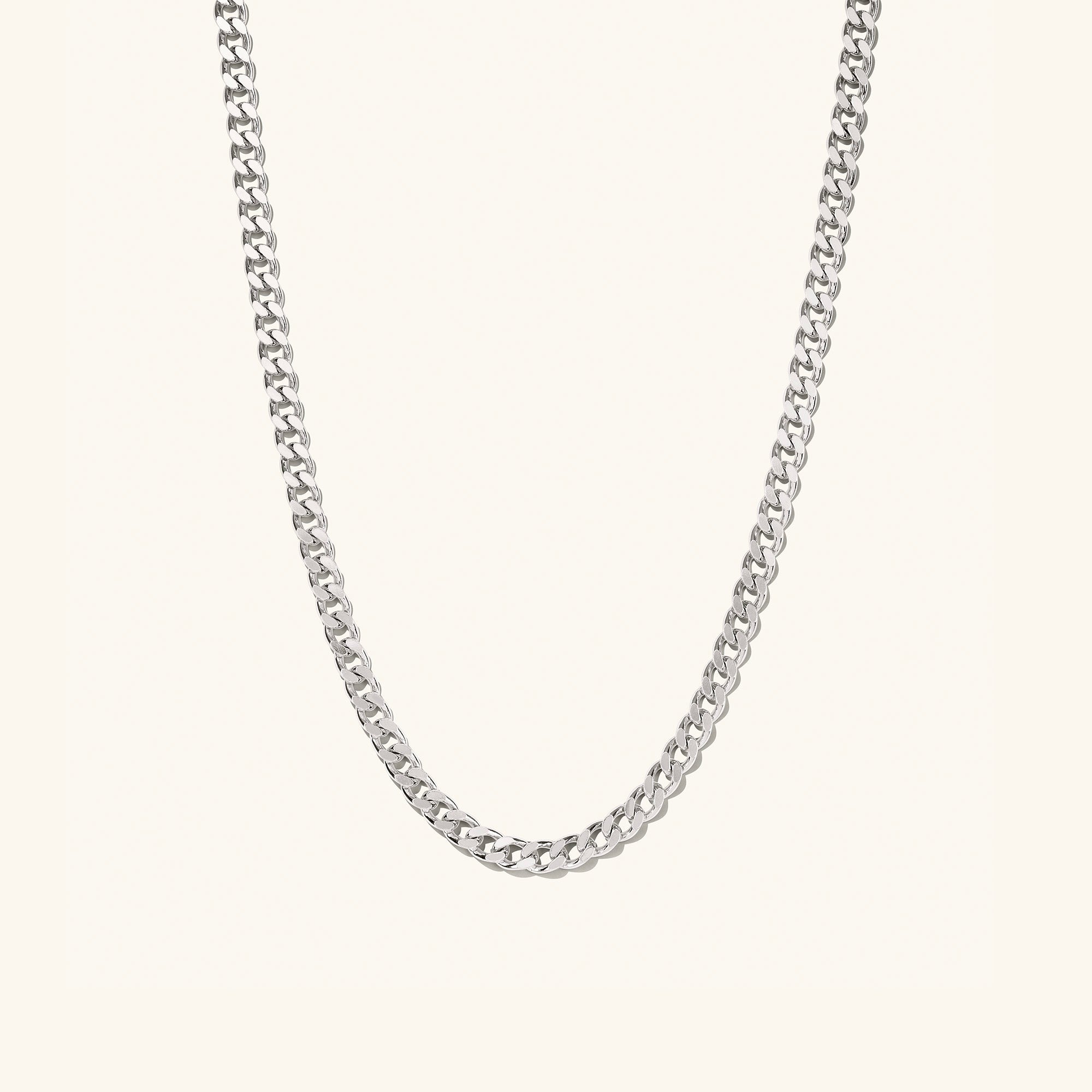 5mm Curb Chain Necklace: A sleek silver chain, perfect for everyday wear, styled solo or layered for a statement.
