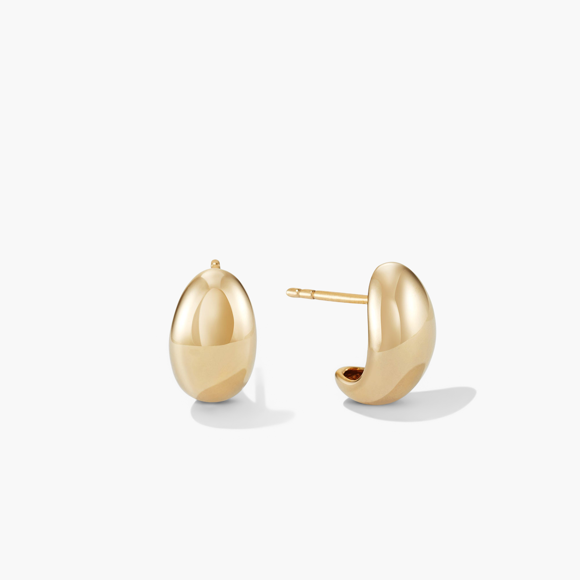 DÃ´me Huggies: Sculptural, lobe-hugging gold earrings from Mejuri's iconic collection, perfect for stacking and everyday wear.