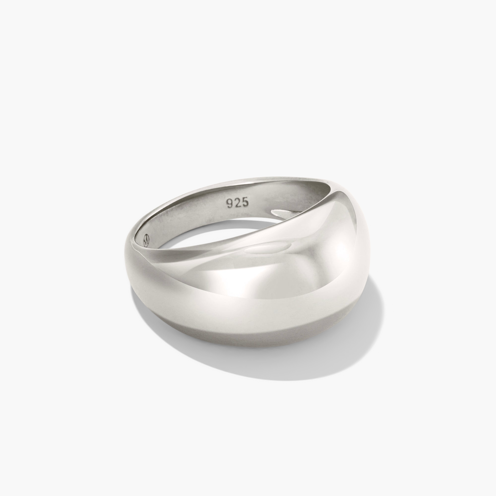 Silver DÃ´me Ring with a polished, curved design casting a shadow. Ideal for stacking with delicate rings for a bold, classic look.