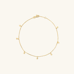 Dot Chain Anklet: A handcrafted 14k solid gold anklet featuring a delicate chain with small dots and a clasp. Ideal for stacking in your jewelry collection.