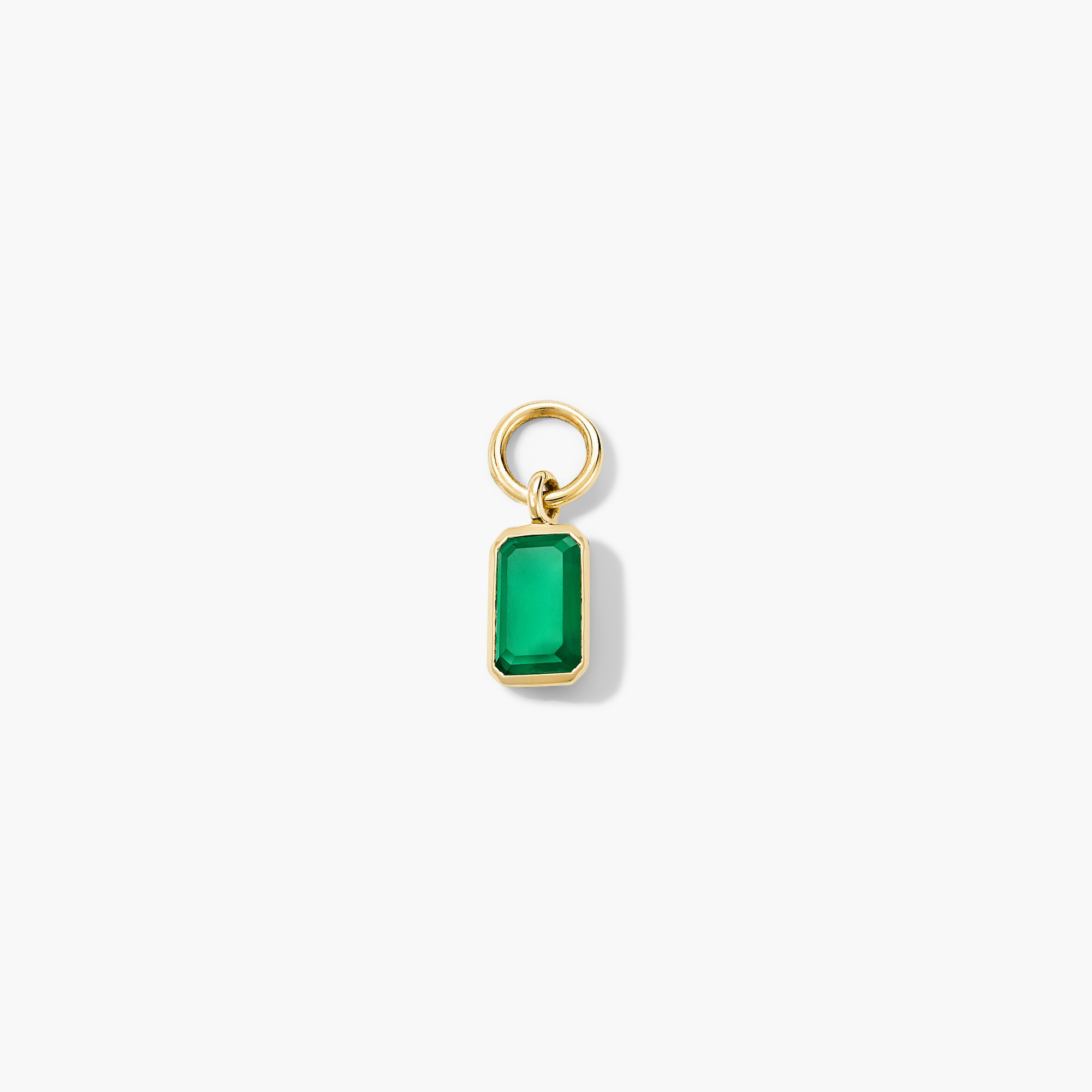 Close-up of a Single Emerald Cut Gemstone Hoop Charm showcasing a green gem set in a gold ring, perfect for personalizing hoop earrings.