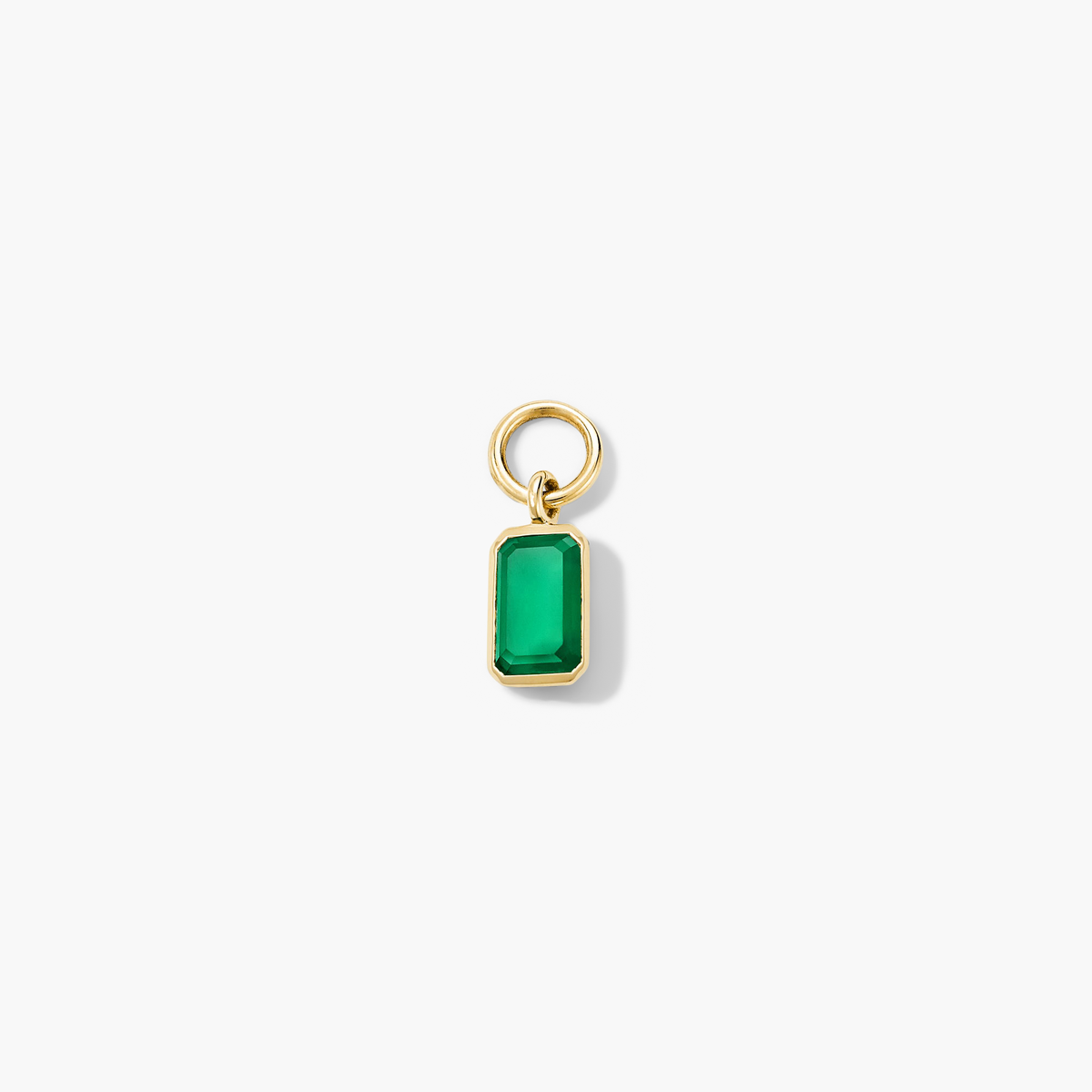 Close-up of a Single Emerald Cut Gemstone Hoop Charm showcasing a green gem set in a gold ring, perfect for personalizing hoop earrings.