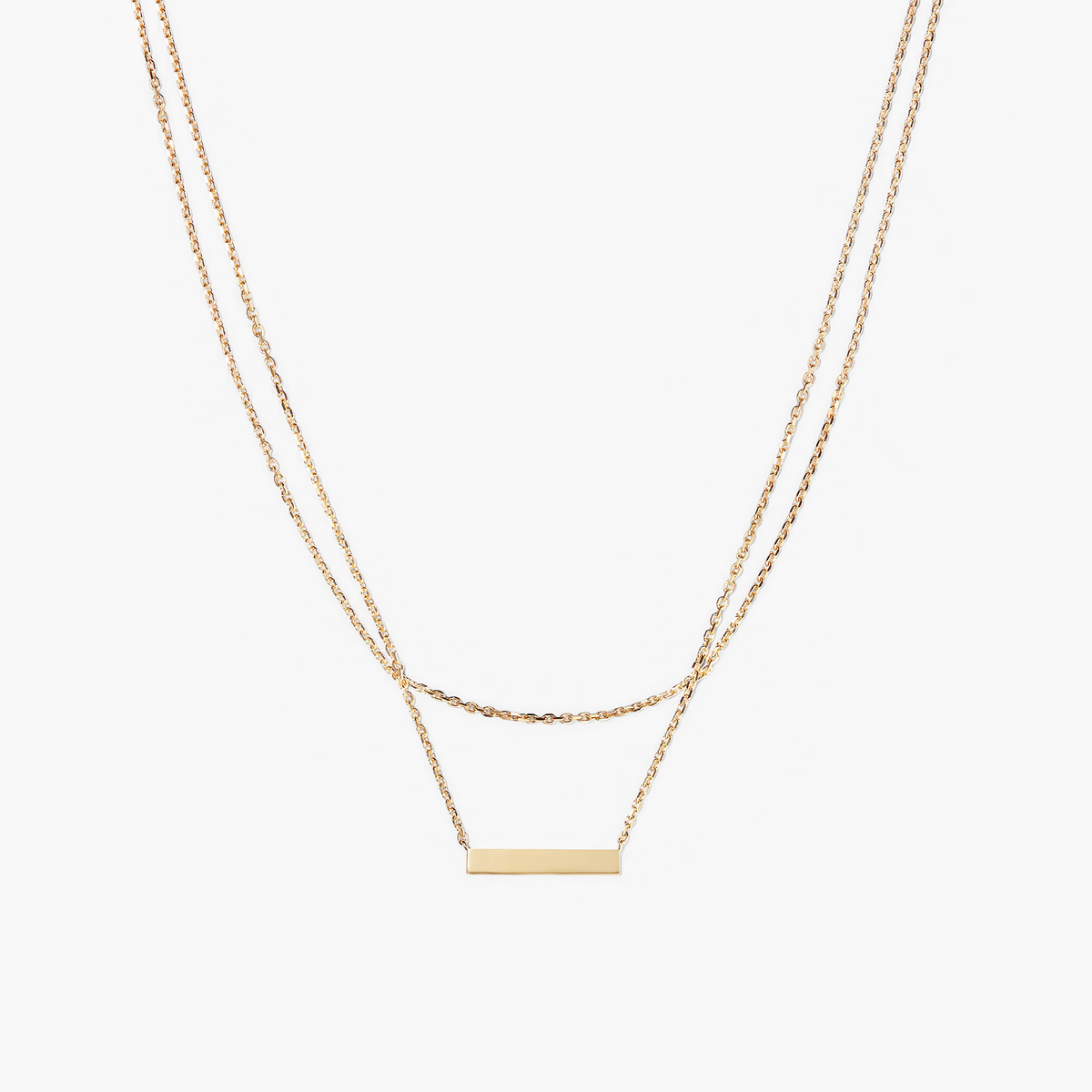 Layered Bar Necklace featuring a sleek gold rectangular pendant on a delicate chain, designed for everyday wear and versatile style.