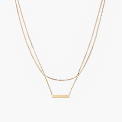 Layered Bar Necklace featuring a sleek gold rectangular pendant on a delicate chain, designed for everyday wear and versatile style.