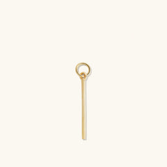 Single Bar Hoop Charm: A close-up of a gold key-shaped charm designed to be added to hoop earrings for a personalized, high-impact look.