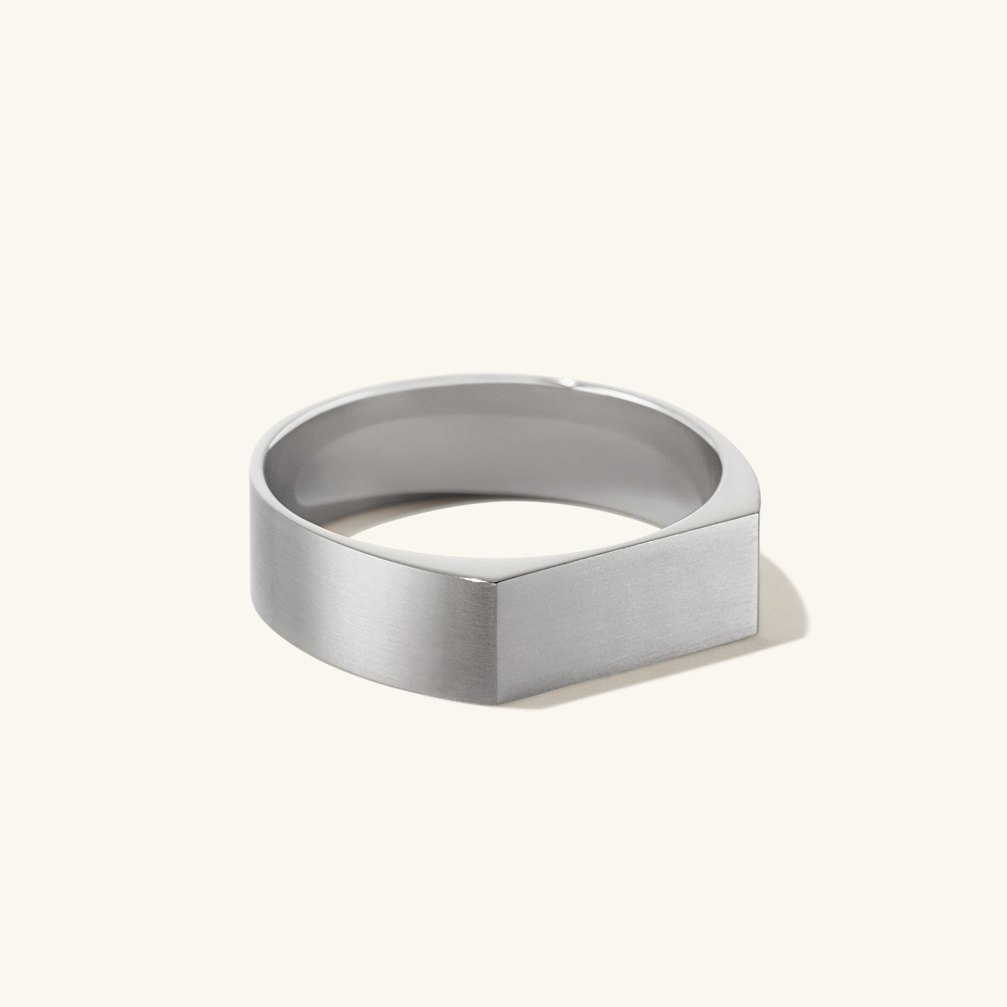 Slim Rectangular Signet Ring: A silver ring featuring a bold, hexagonal shape, perfect for making a statement in any jewelry collection.
