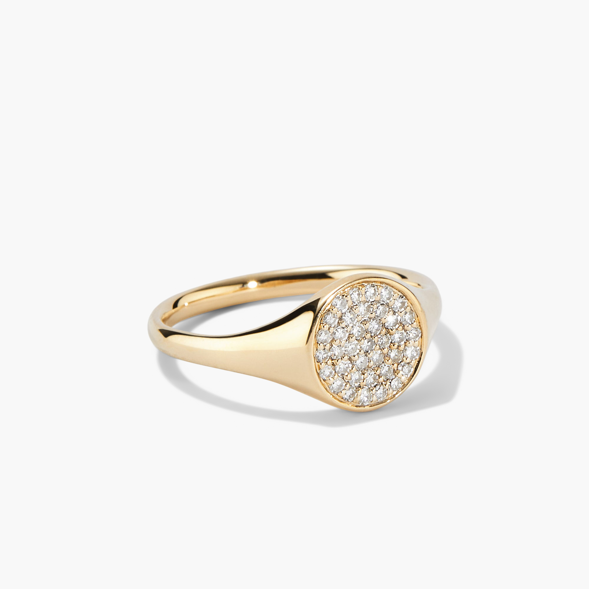 PavÃ© Diamond Signet Pinky Ring featuring intricate gold craftsmanship adorned with sparkling diamonds, highlighting its elegant design and luxurious appeal.