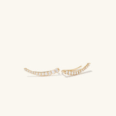 PavÃ© Diamond Climbers: Handcrafted 14k gold earrings featuring pavÃ© diamonds, designed to enhance your ear stack with a single piercing.