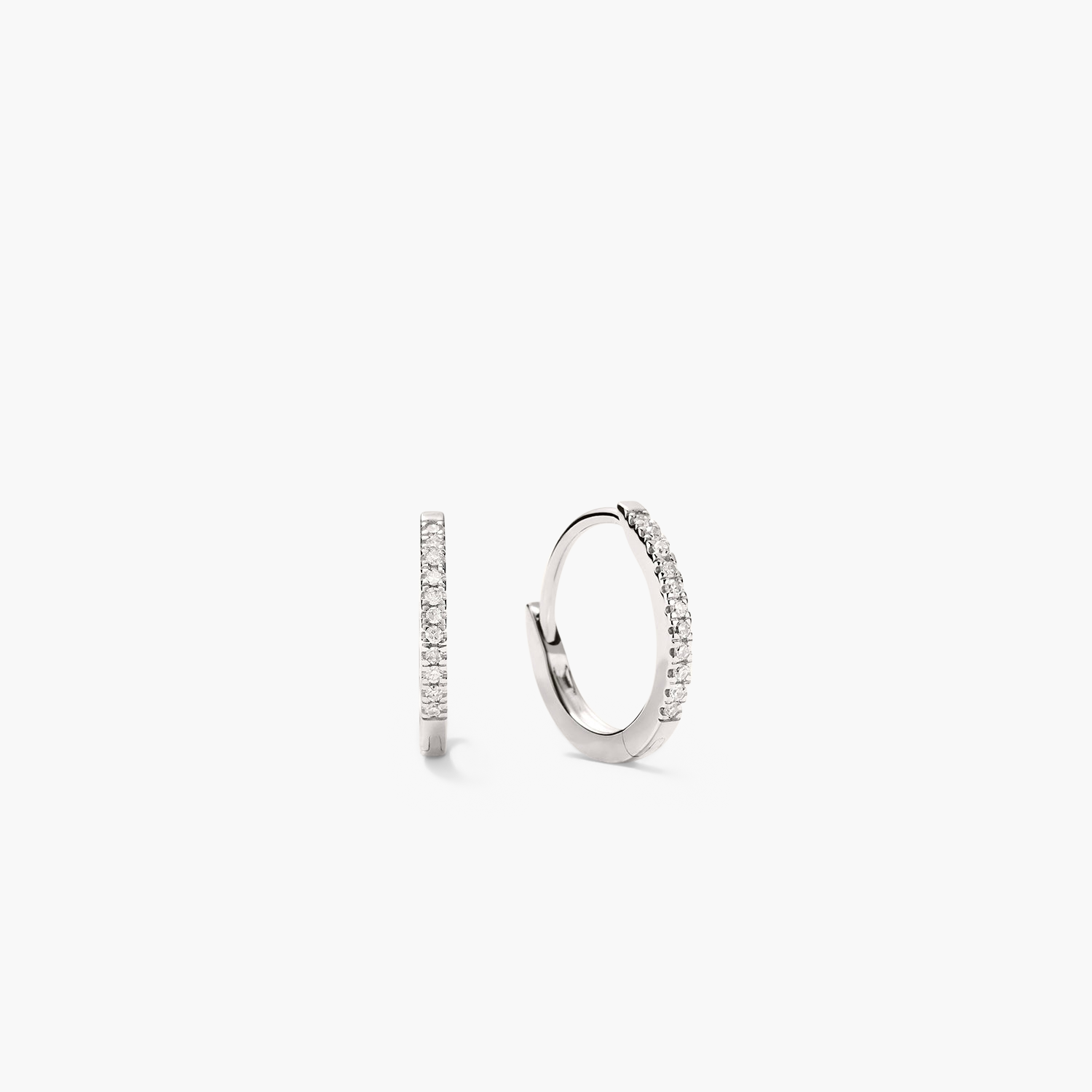 PavÃ© Diamond Huggie Hoops crafted in recycled 14k solid gold, featuring diamond accents. Designed for versatility, can be worn with pavÃ© diamonds or a sleek finish.