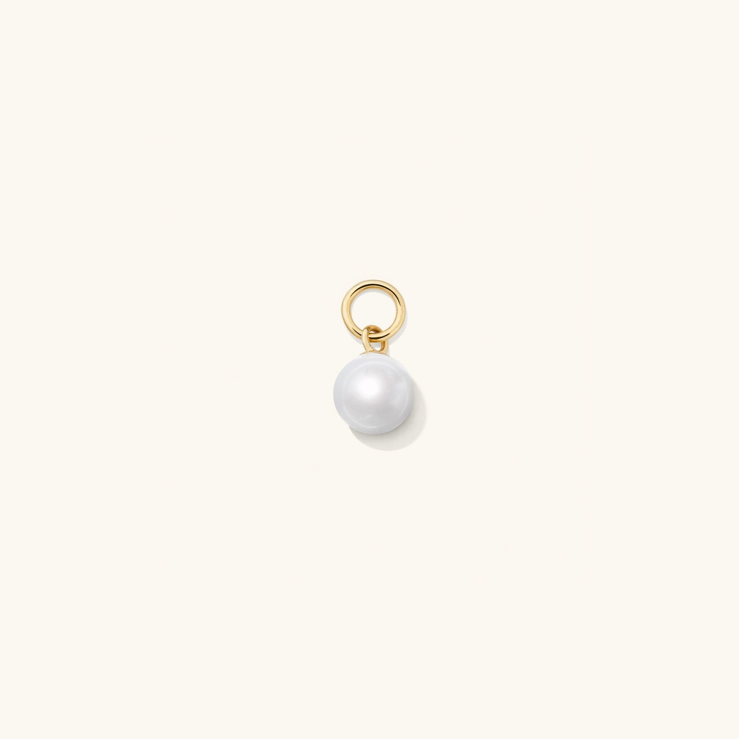 Single Pearl Hoop Charm: A close-up image showcasing a single pearl charm designed to personalize and enhance your hoop earrings for a versatile, high-impact accessory.
