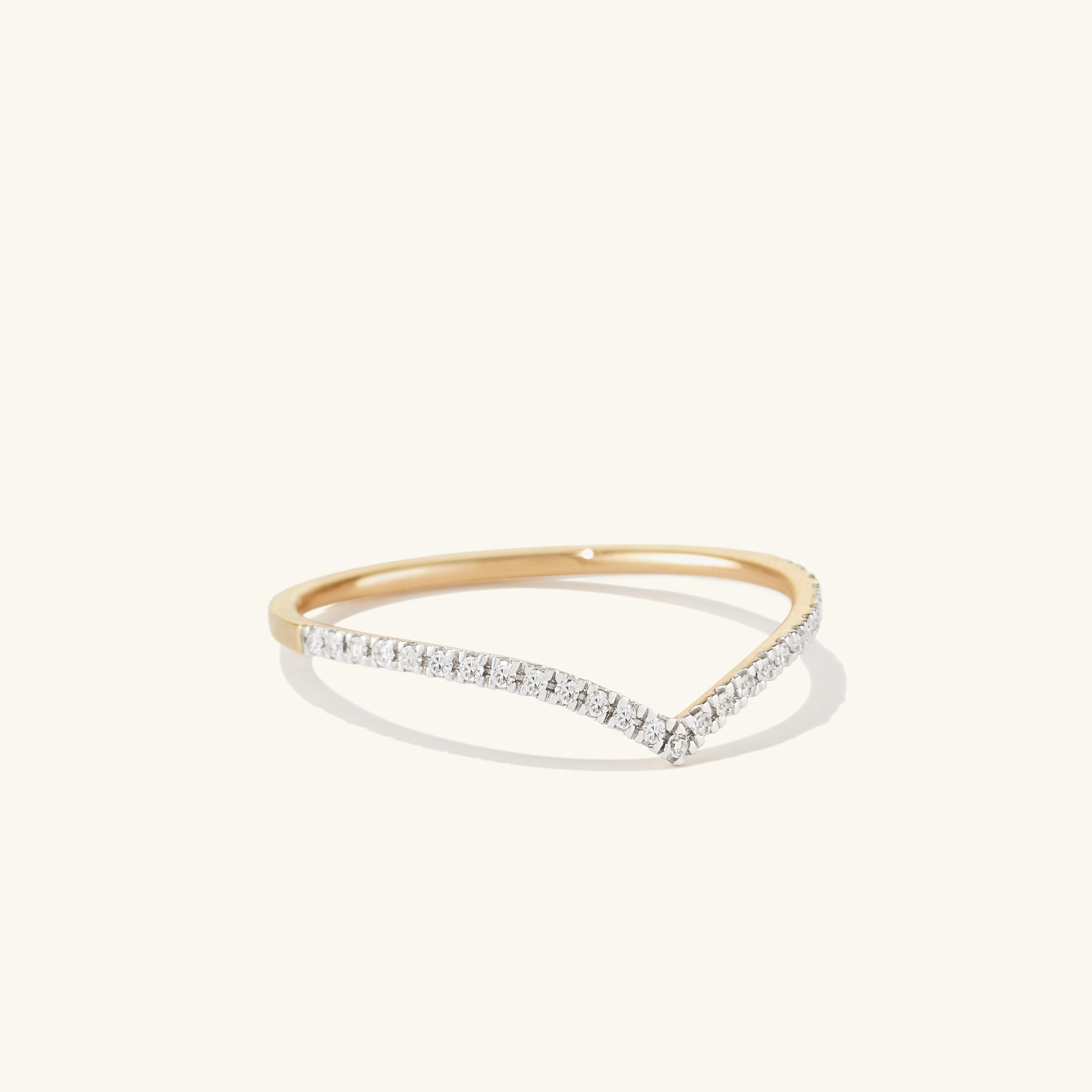 Wishbone Stacker Set featuring gold and diamond rings. Close-up highlights intricate design, perfect for creating a stylish, everyday ring stack.