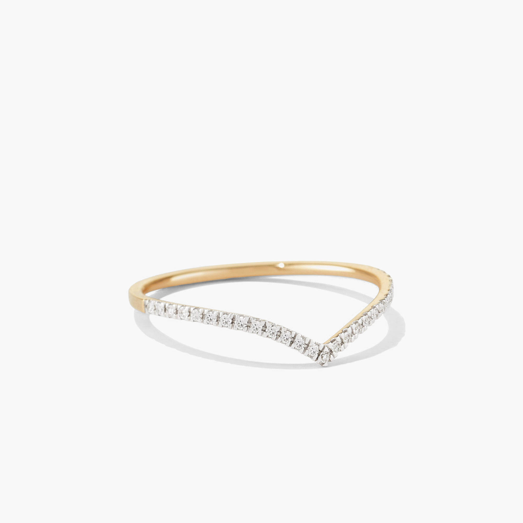 Wishbone Stacker Set featuring gold and diamond rings. Close-up highlights intricate design, perfect for creating a stylish, everyday ring stack.