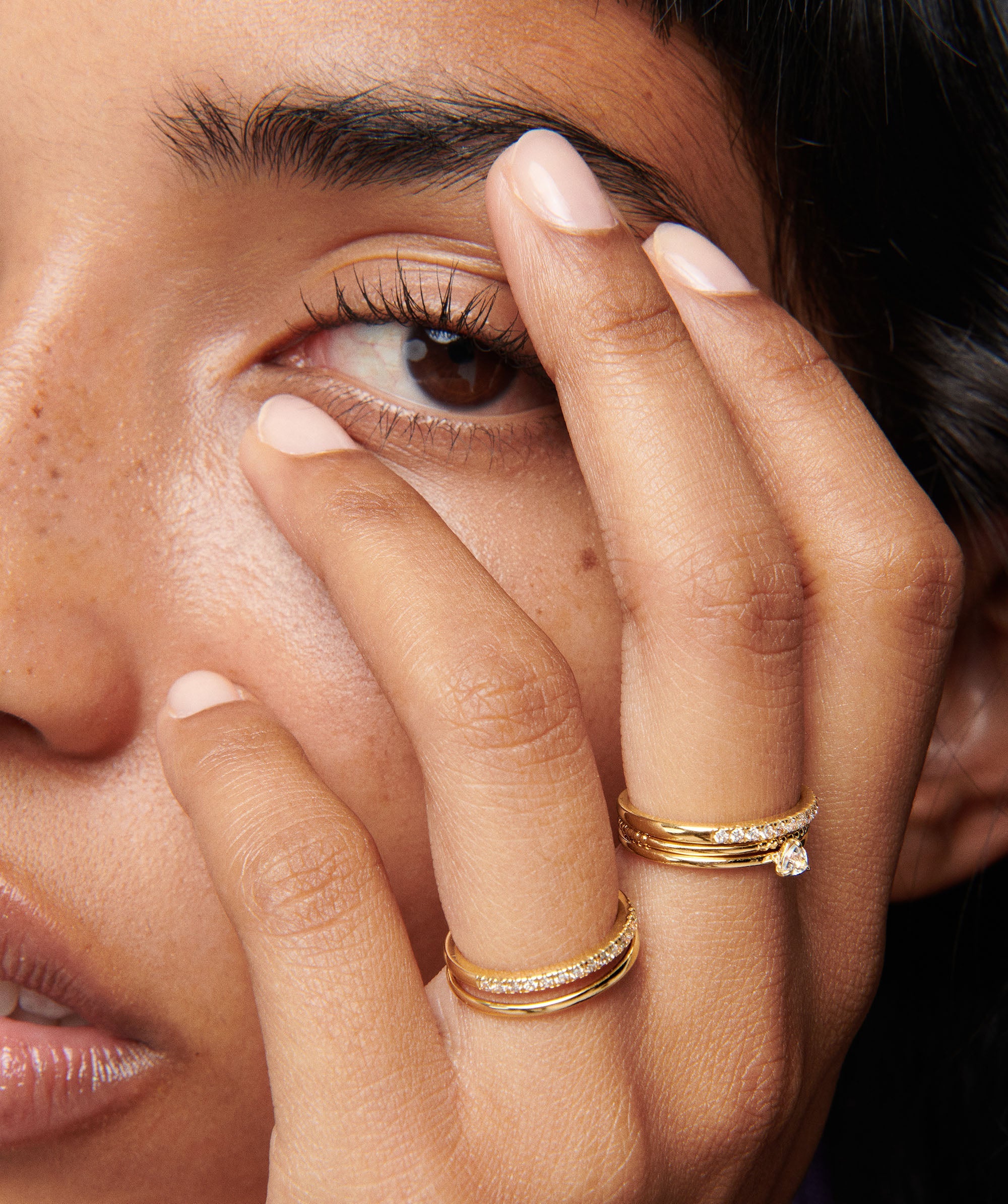 Close-up of a woman's hand showcasing the Diamonds Team Ring, highlighting its elegant design and intricate details.