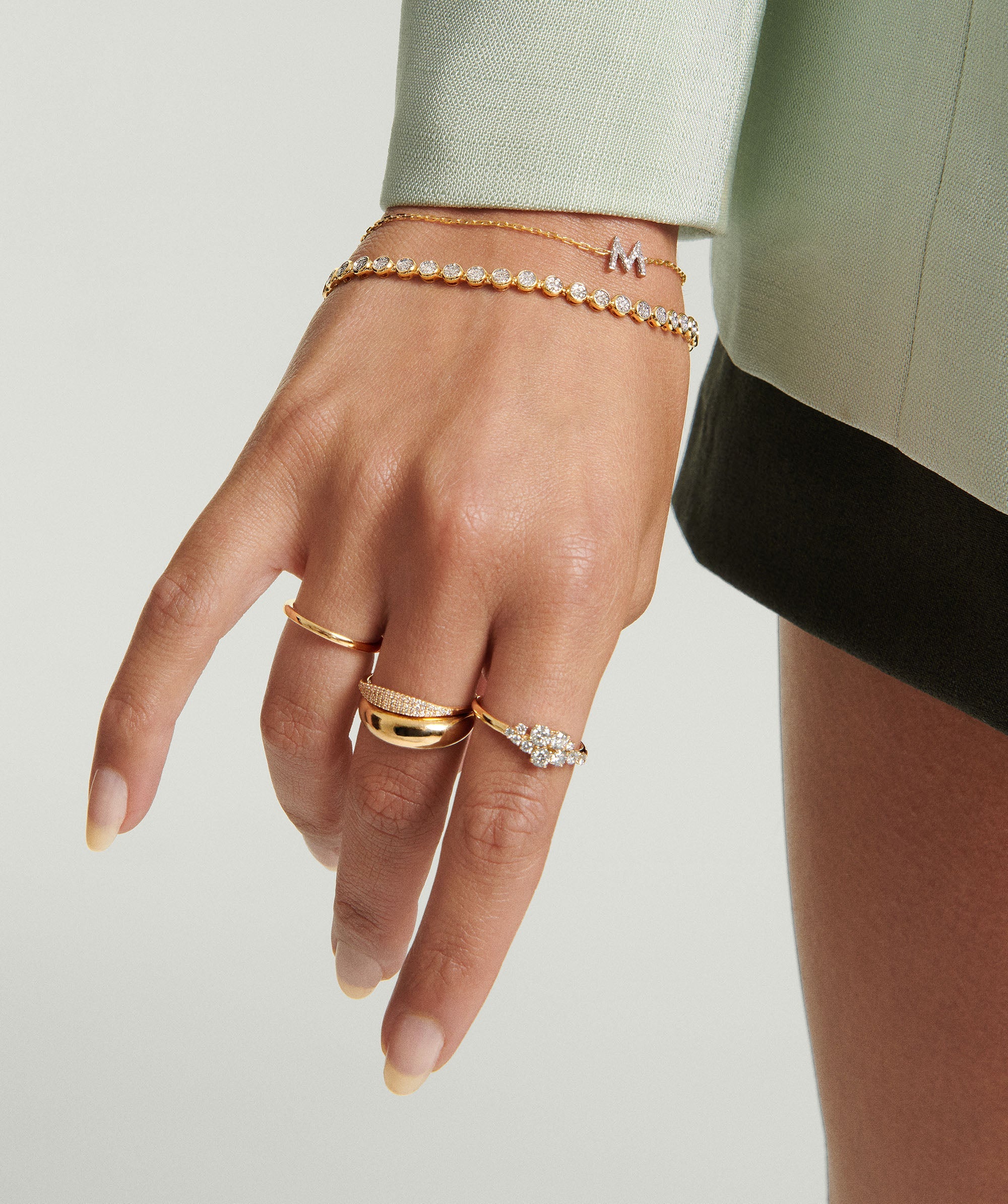 Hand adorned with Diamonds Cluster Ring featuring an asymmetric organic design and eleven prong-set diamonds, highlighting the ring's unique elegance and heirloom potential.