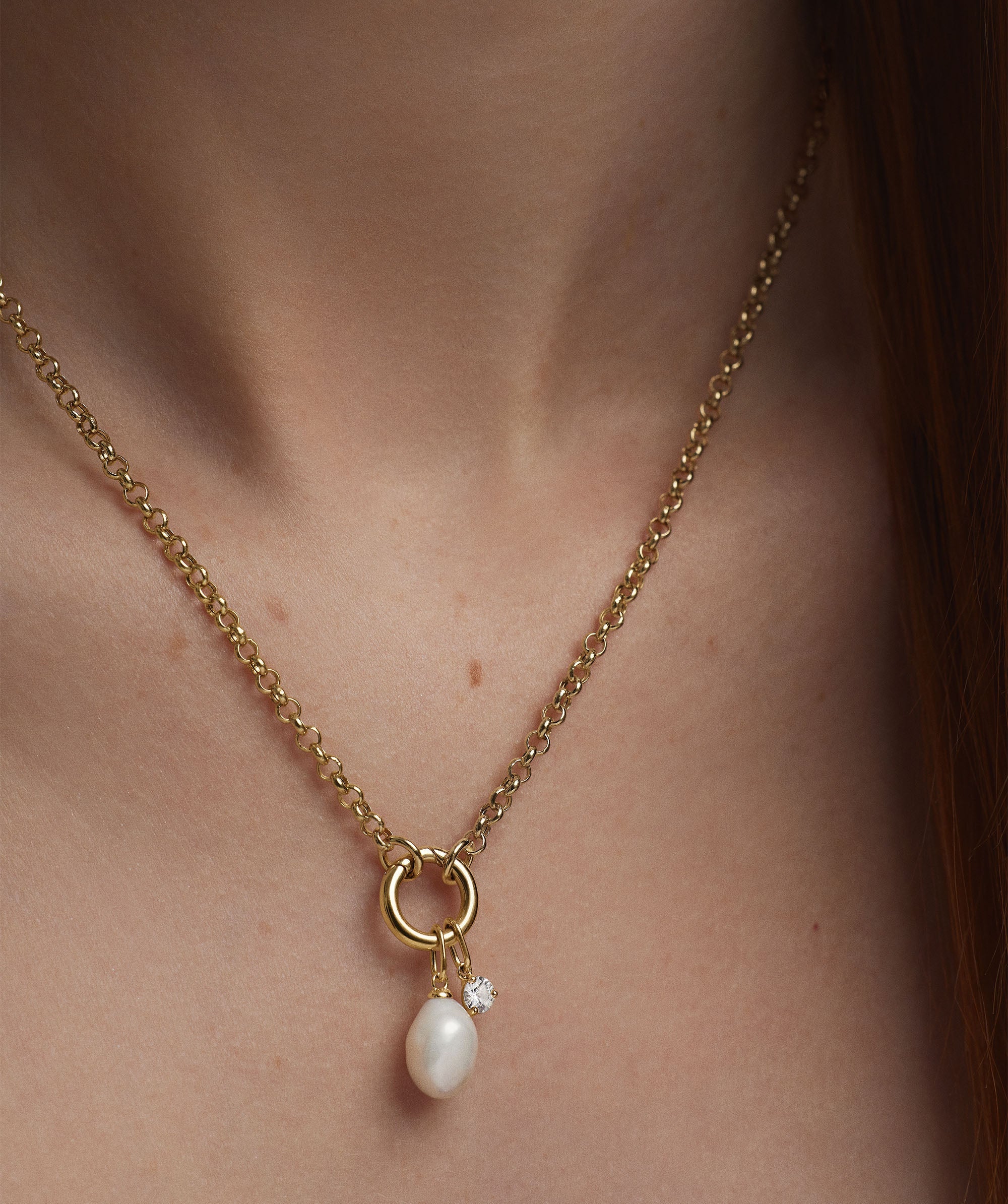 Woman wearing Organic Pearl Charm necklace with a pearl and diamond pendant.