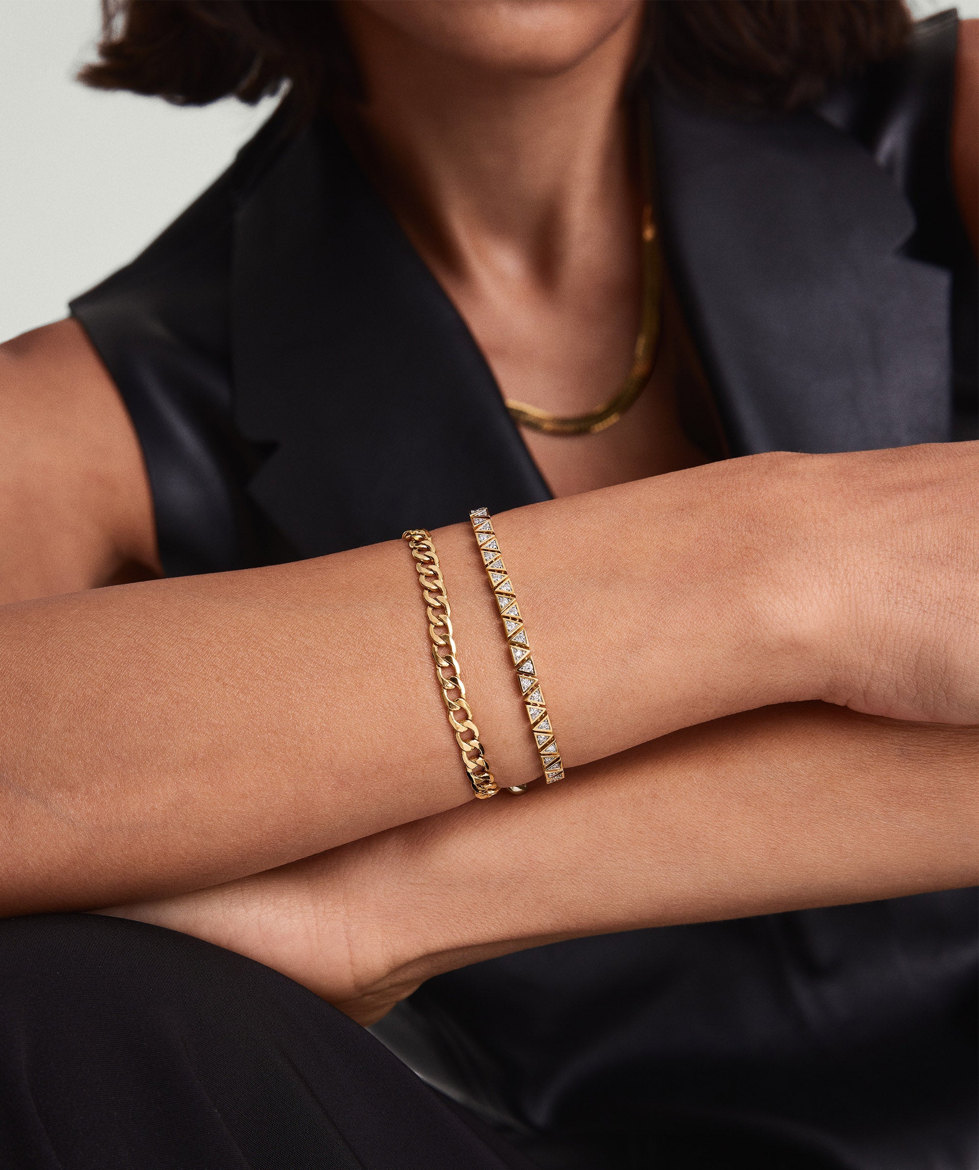 A woman wearing the Patra Diamond Tennis Bracelet, handcrafted in 14k gold with responsibly sourced diamonds.