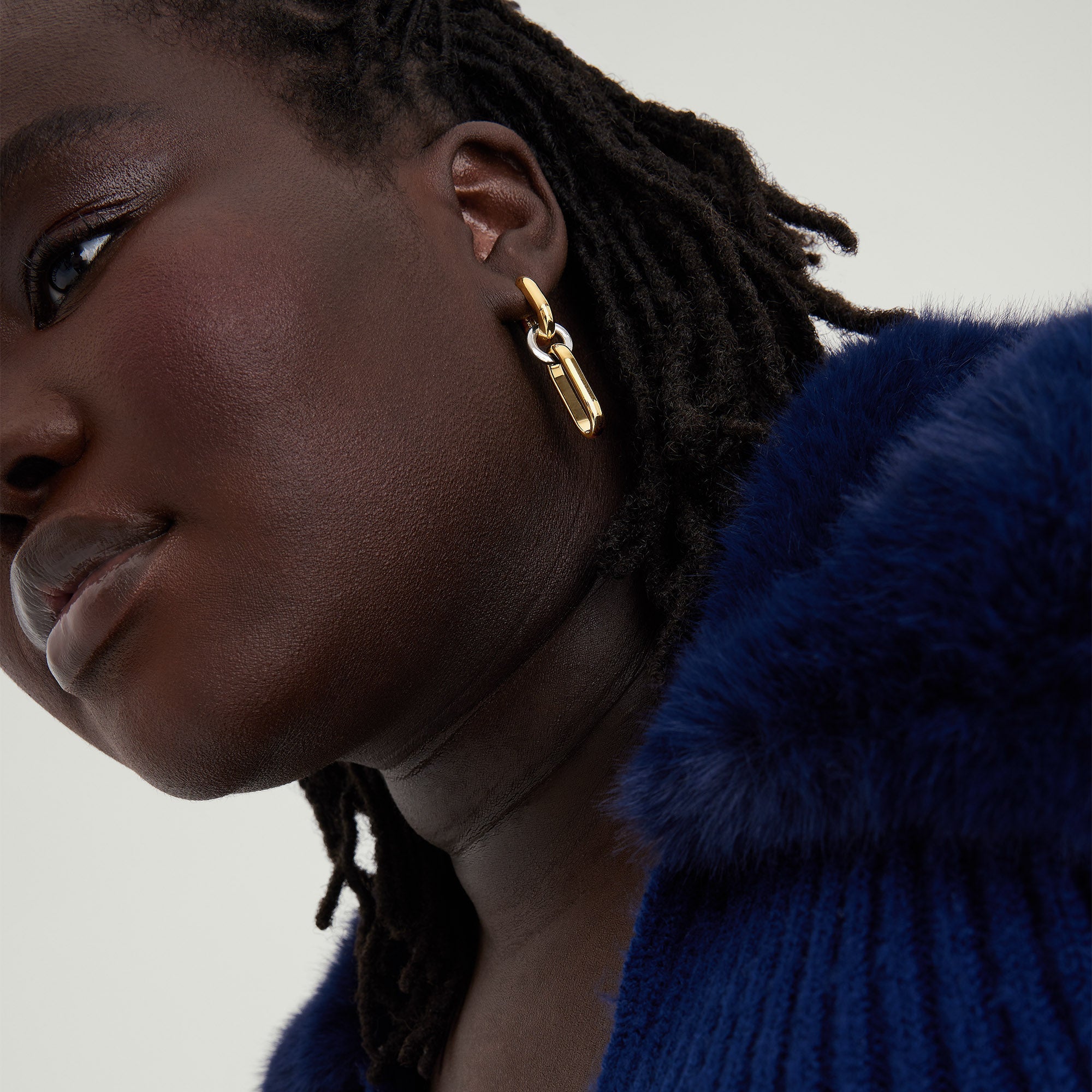 Mixed Convertible Link Earrings shown worn by a woman. Close-up highlights the intricate 18k gold vermeil and sterling silver links.
