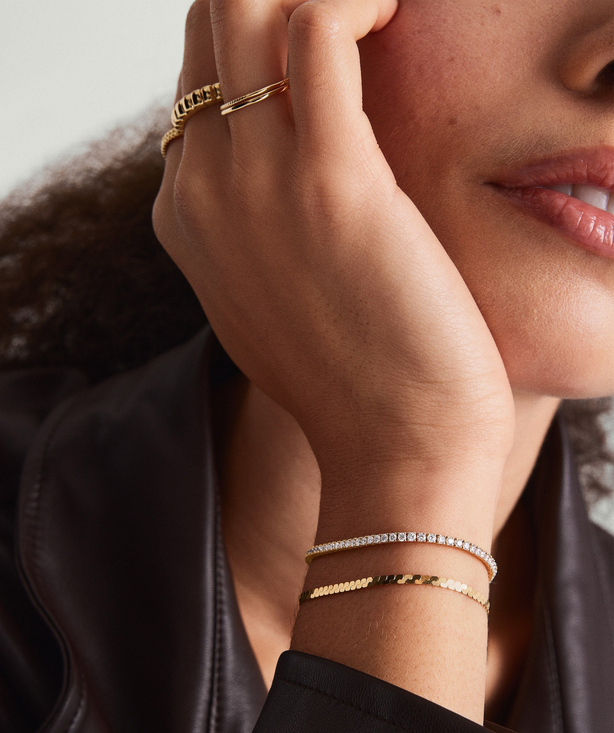 Close-up of a woman's hand wearing the Lab Grown Diamond Tennis Bracelet 1.8mm, showcasing its elegant 14k solid gold and sparkling lab-grown diamonds.