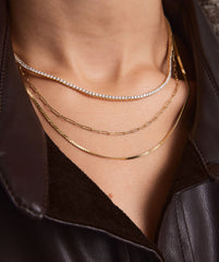 Person wearing a leather jacket and Lab Grown Diamond Tennis Necklace 1.8mm, featuring lab grown diamonds set in 14k solid gold.
