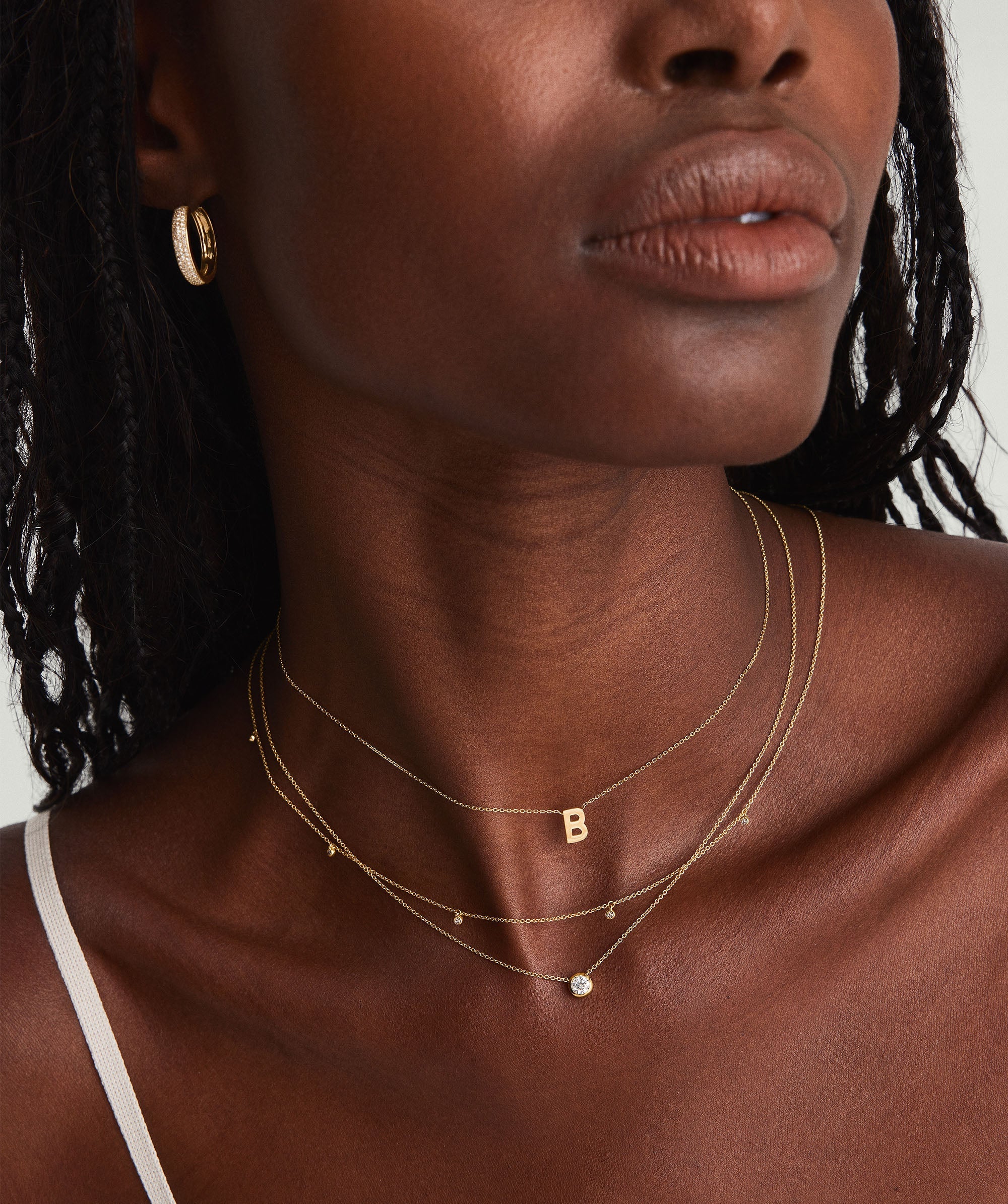 Close-up of a woman's neck showcasing a large diamond necklace, an heirloom-worthy piece designed for lasting elegance and timeless beauty.