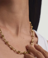 Person wearing the Multi Way Chain Necklace, showcasing its customizable design, perfect for mixing lengths and adding charms for versatile styling.