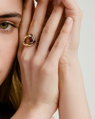 Close-up of a woman's hand wearing the Organic DÃ´me Curve Gemstone Ring, showcasing its unique organic curves and artistic design.