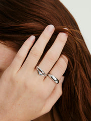 Hand wearing the Organic DÃ´me Crescent Nesting Ring, showcasing its stackable design with lab-grown diamonds, part of the DÃ´me collection.