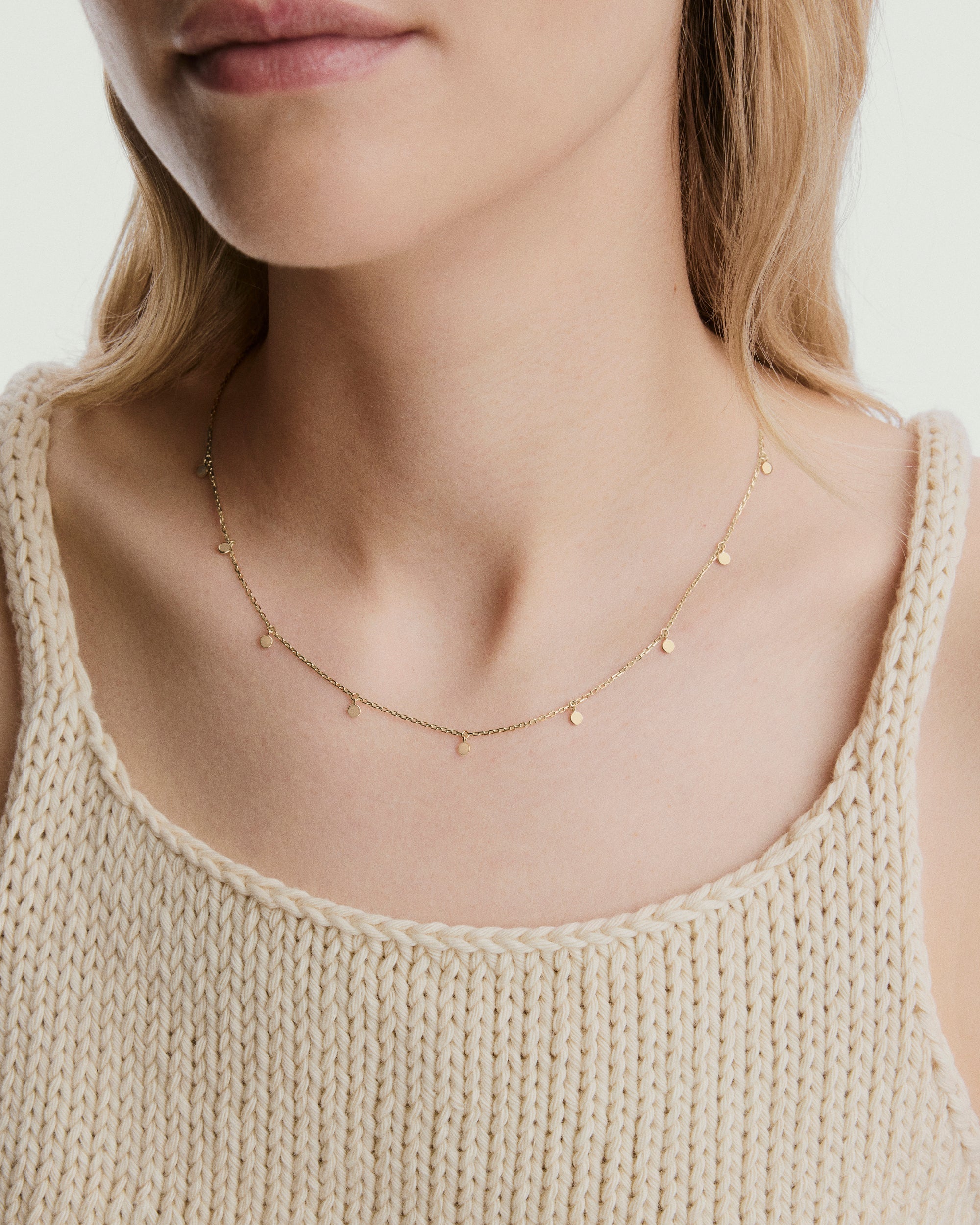 Dot Chain Necklace, featuring mini golden dots, designed for layering and adding dimension to your jewelry stack. A versatile accessory for enhancing any ensemble.