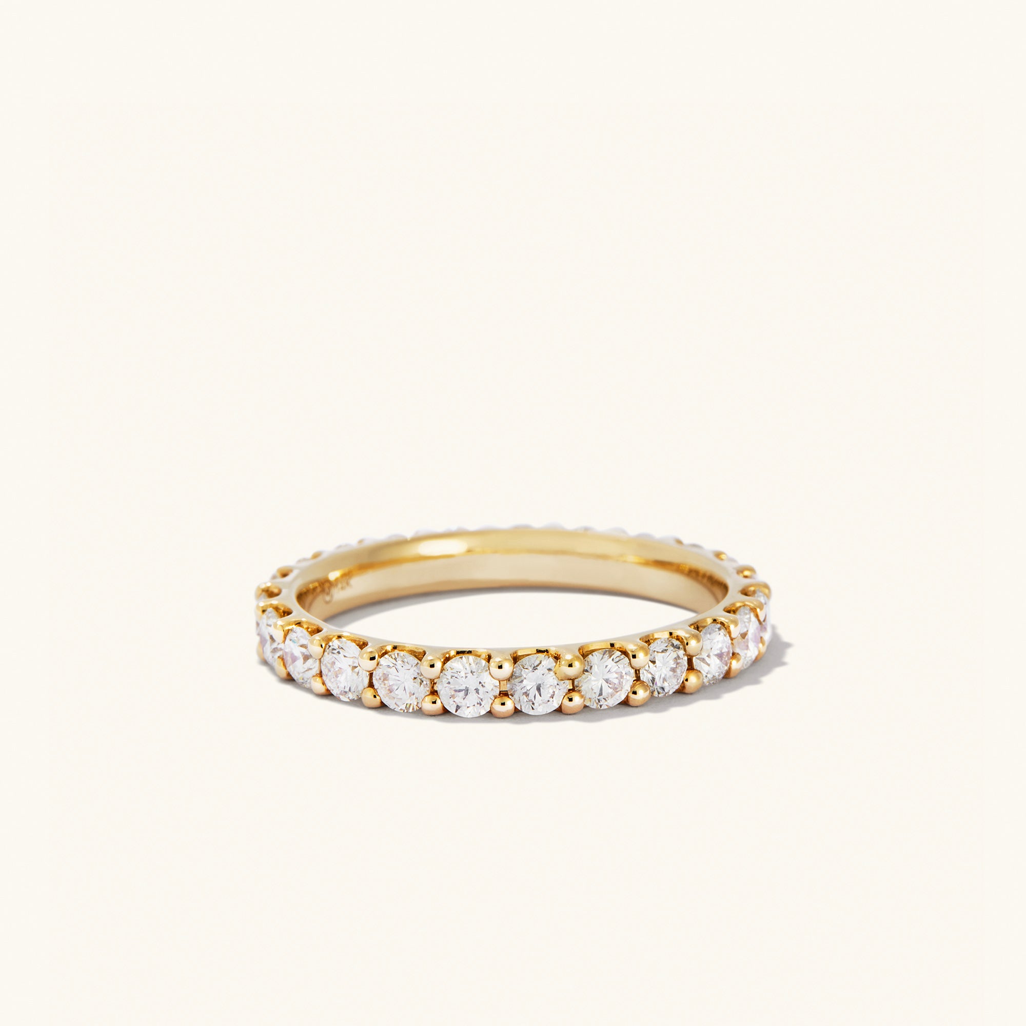 Bold Diamond Eternity Ring: 14k gold ring with 23 round brilliant cut diamonds in open prong settings, designed for maximum sparkle.