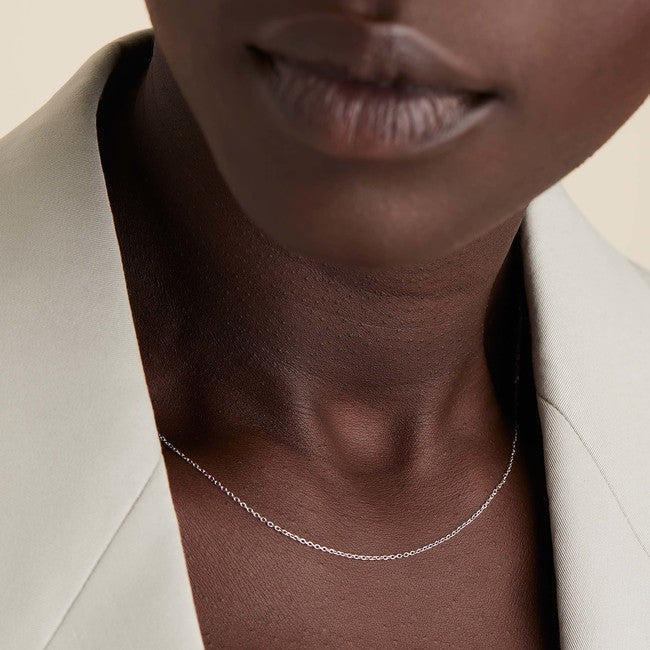 Chain Necklace displayed close to a woman's neck, ideal for layering or adding charms, emphasizing the sleek and fashionable design.
