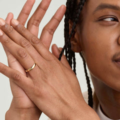 Close-up of a person's hand wearing the 4mm Curve Band, showcasing its elegant and lightweight design.