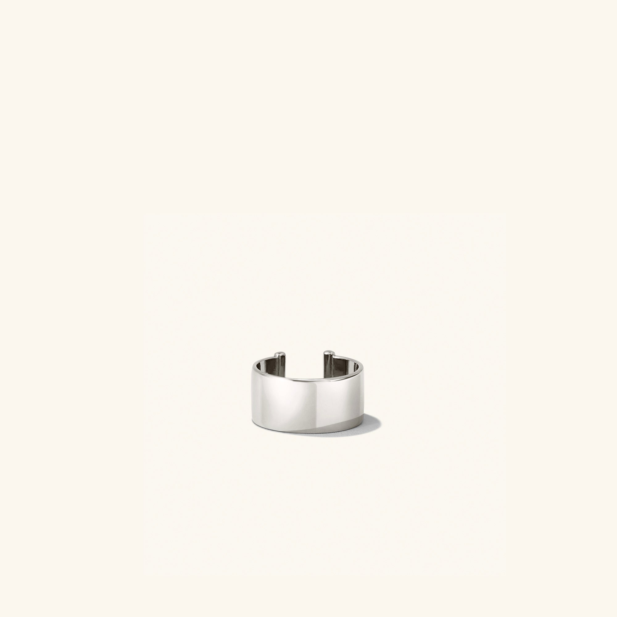 Daily Ear Cuff: A polished, high-shine silver ring on a white background, embodying timeless elegance and handcrafted in vermeil with an 18k gold layer.