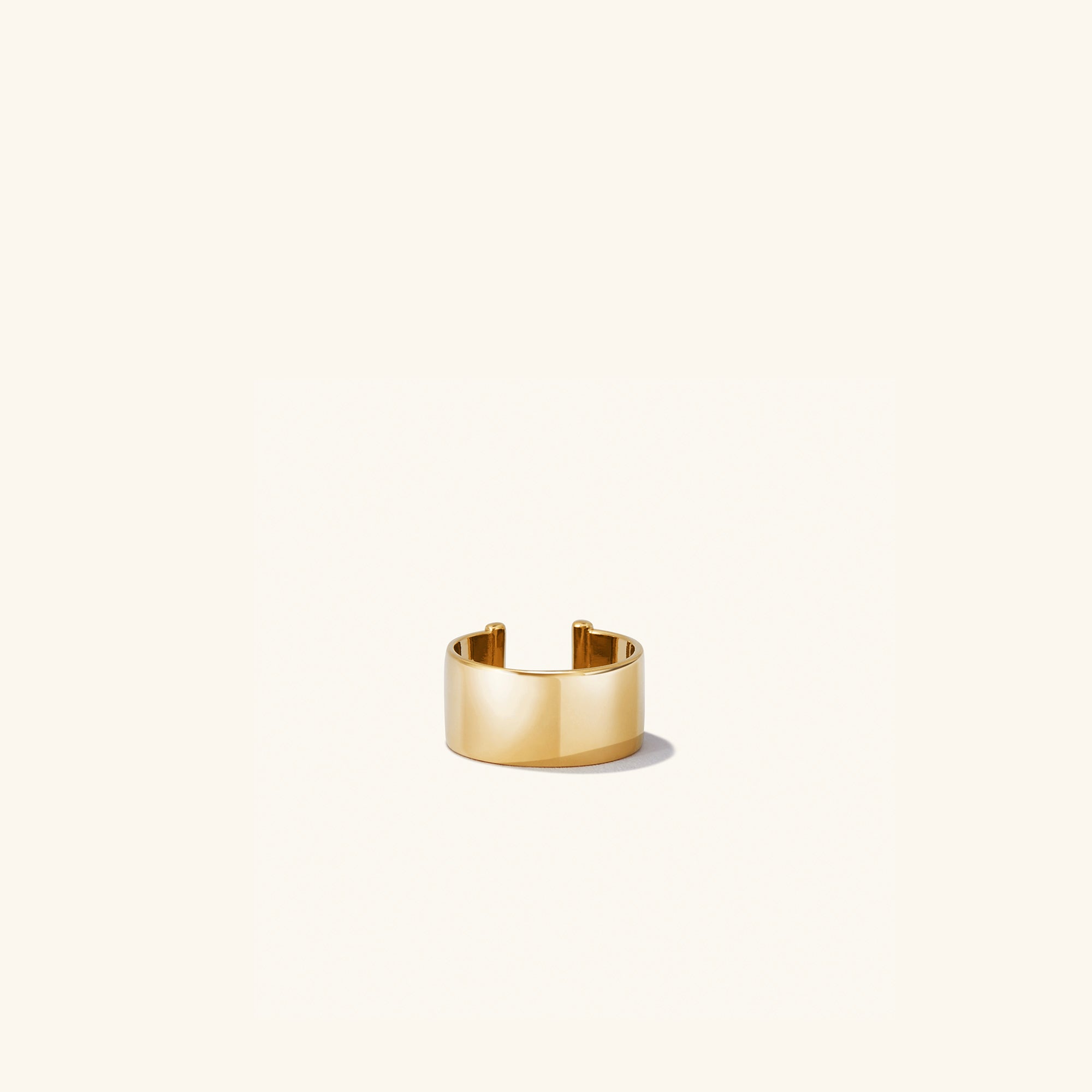 Daily Ear Cuff in vermeil, showcasing a polished, high-impact shine on a white background, reflecting its classic, handcrafted design.