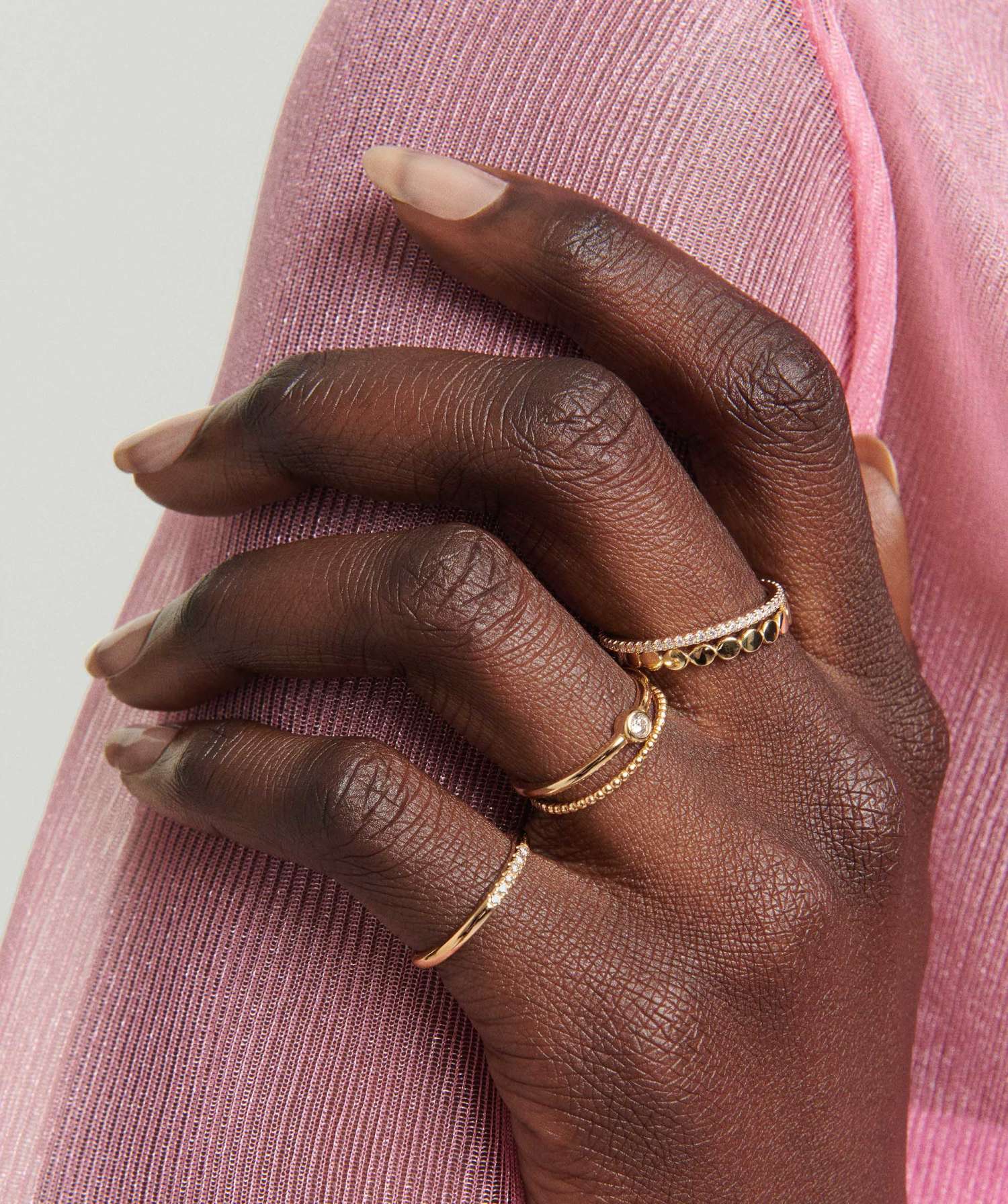 Hand wearing a 14k white gold Beaded Ring, showcasing its delicate design and durability.