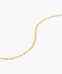 Mini Anchor Chain Necklace with polished, flat interlocking links, elegantly laid against a white background, ideal for layering or wearing alone.