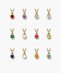 Sia Birthstone Pendant Necklace featuring a gold chain adorned with various sparkling gemstones, perfect for personalizing with your birthstone or gifting.