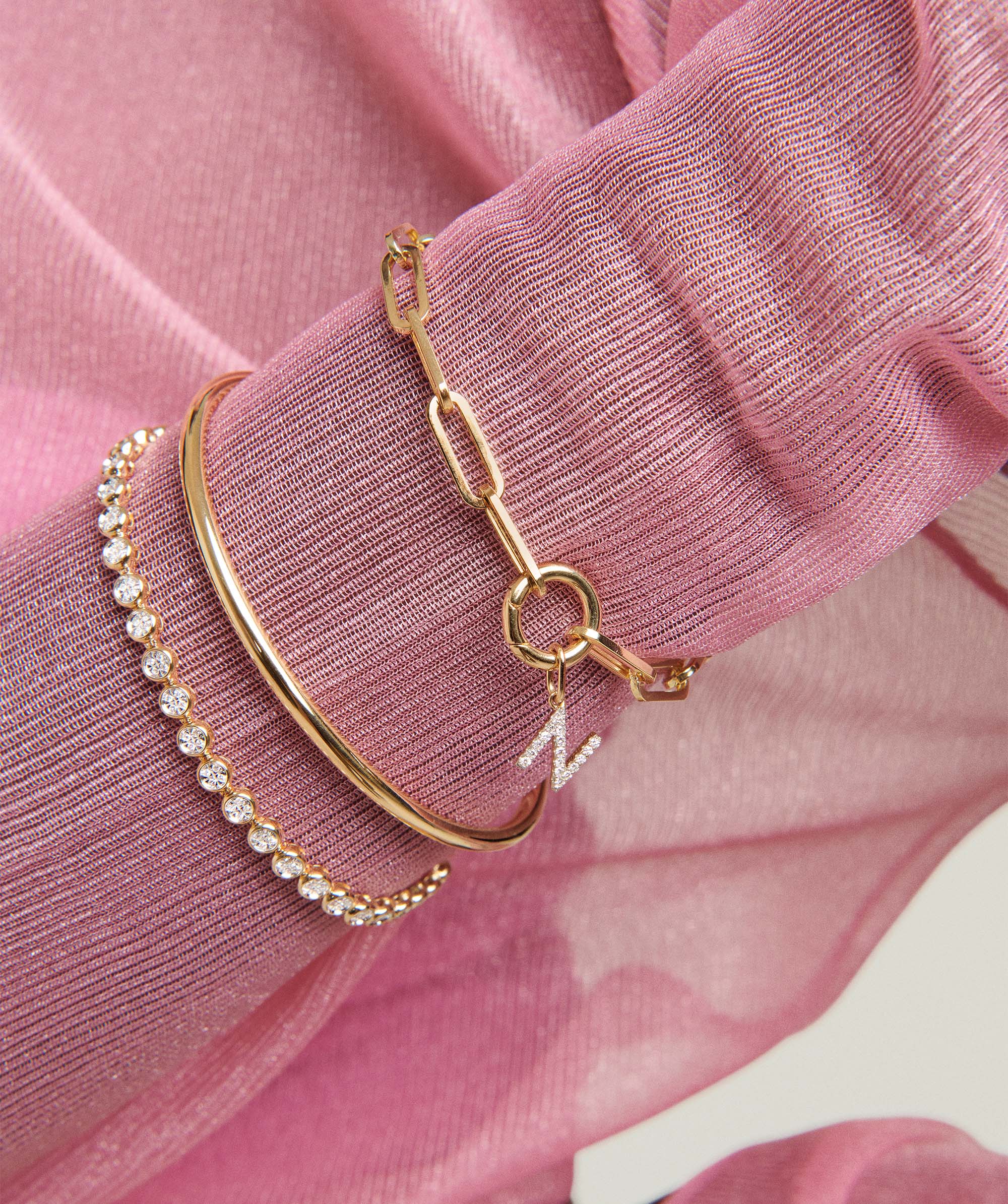 Diamond Letter Charm bracelet close-up, showcasing intricate detailing. Perfect for personalization; pairs well with various chain necklaces. Chain is sold separately.