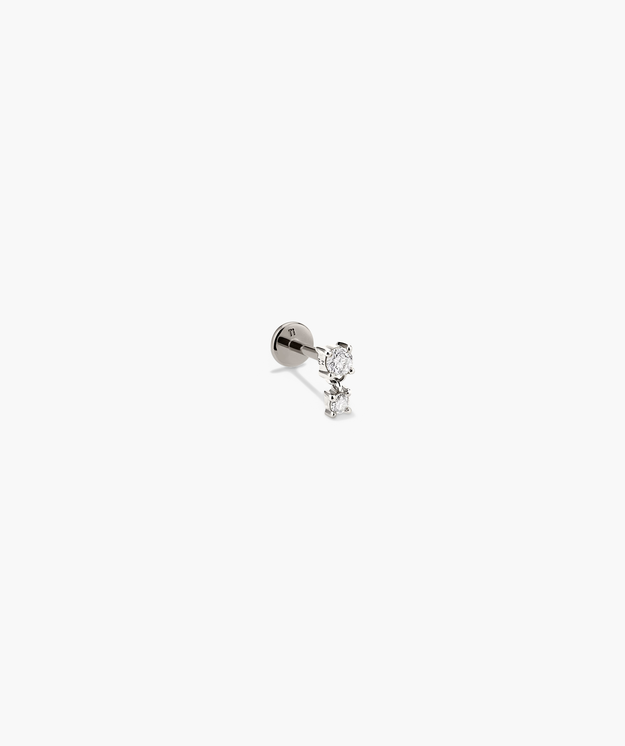 Diamond Droplet Stud earring, silver with diamond accents, showcased in a detailed close-up, highlighting its intricate design and elegant craftsmanship.